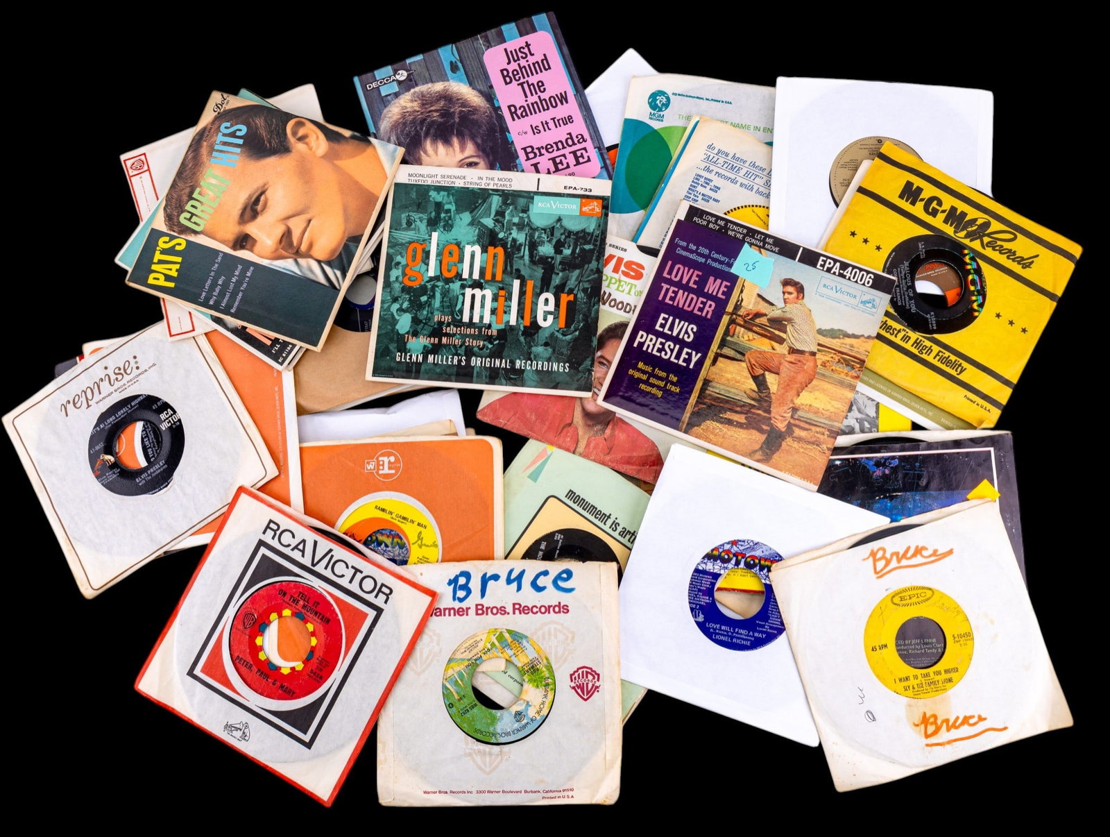 Vintage 45 RPM Records: Collection of approx. 30+ vintage 45 RPM records, primarily mid-20th century popular music, housed in a mix of paper sleeves. Artists include Nat "King" Cole, Connie Francis, Dean Martin, Bobby Vinton