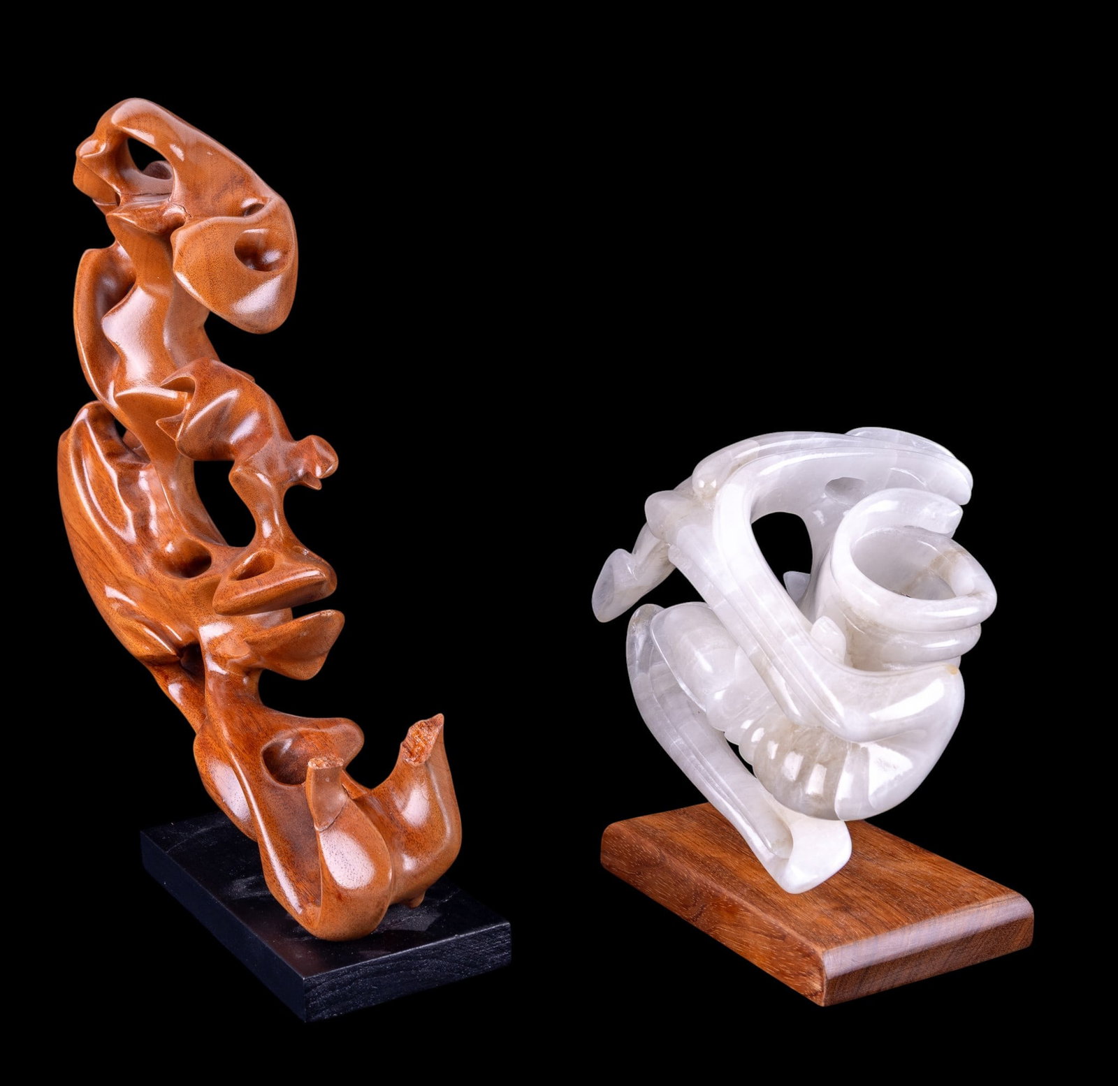 Carved Wood & Alabaster Abstract Sculptures: A carved and lacquered wood sculpture signed 'G. Wanner'. Note some loss and restoration. Measures approx. 13" W x 14" H. Also included is a carved and polished alabaster abstract sculpture. Not signe