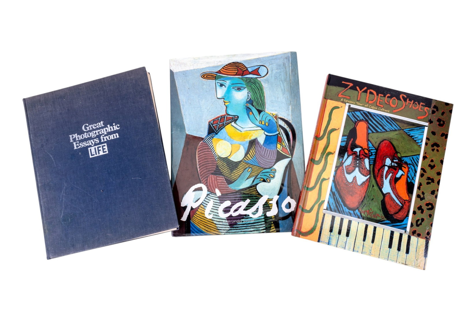 Coffee Table Art Books (3): A collection of three coffee table art books including Great Photographic Essays from LIFE Magazine, Zydeco Shoes: A Sensory Tour of Cajun Culture, and a Picasso book.