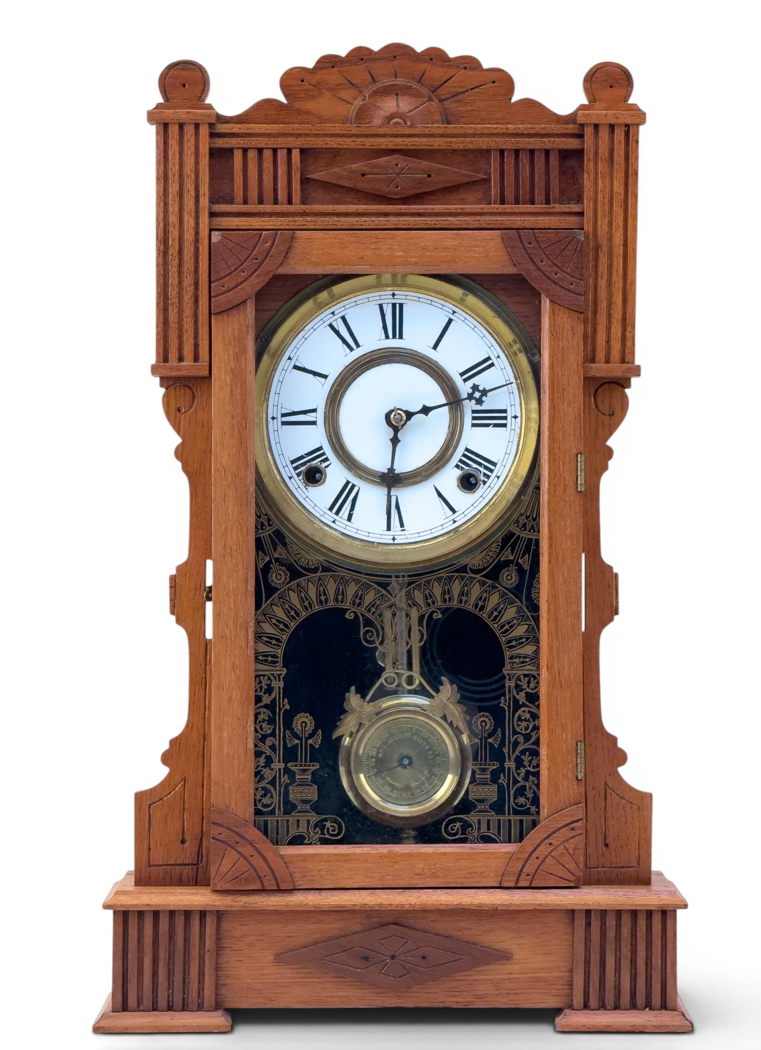 Gilbert "Calpe" Model Hanging Wall Clock: William L. Gilbert Clock Company wall clock, identified by reverse label as the "Calpe" model, Winsted, Connecticut. Architectural carved wood case with applied detailing and crest, fitted with a glaz