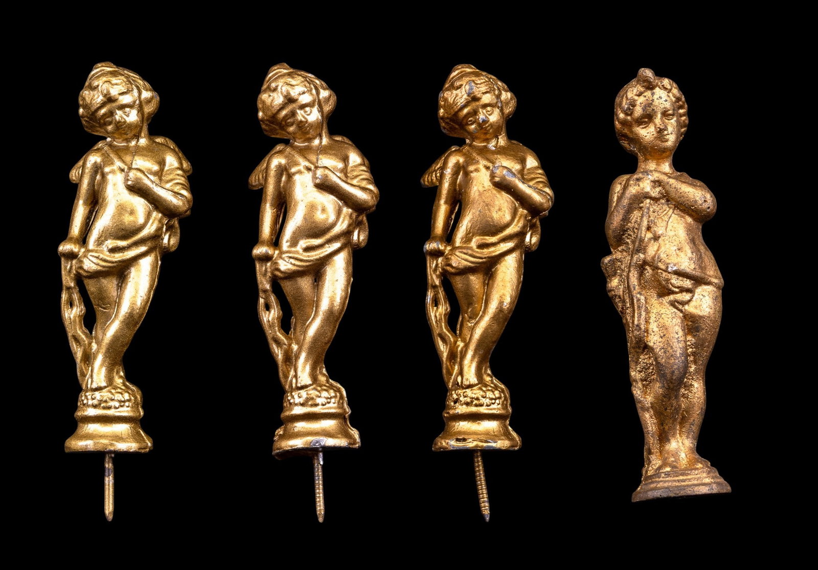 Antique Gilt Bronze Cherub Finials: A collection of four gilt bronze clock finials depicting cherubs, all measure approx. 4-5" H.