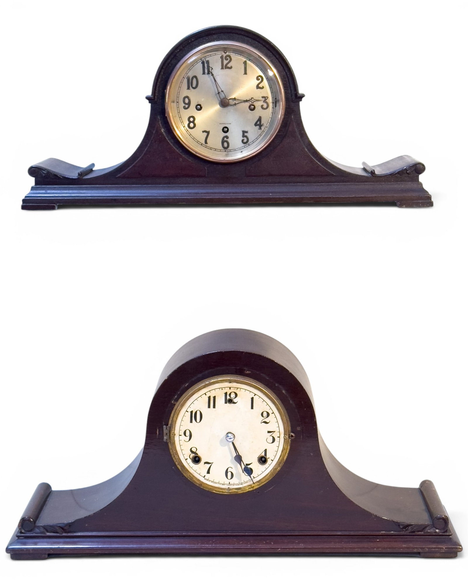 Herschede Mantel Clocks (2): Lot includes 2 spring driven mantel clocks in mahogany-finished cases. One Herschede mantel clock with metal dial, chime movement, pendulum, and retailer plaque to case reading "Herschede Hall Clock