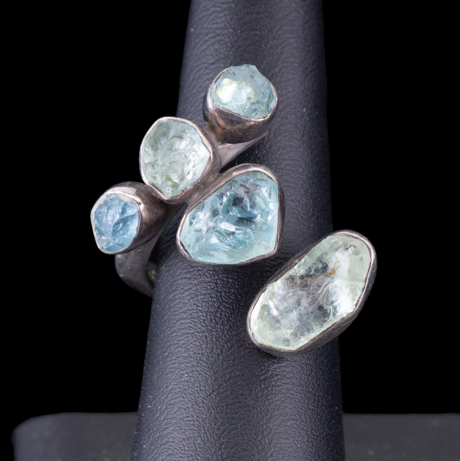 Lilly Barrack Designer Ring: Sterling silver signed Lilly Barrack ring in a modern style set with various aqua-hued stones.