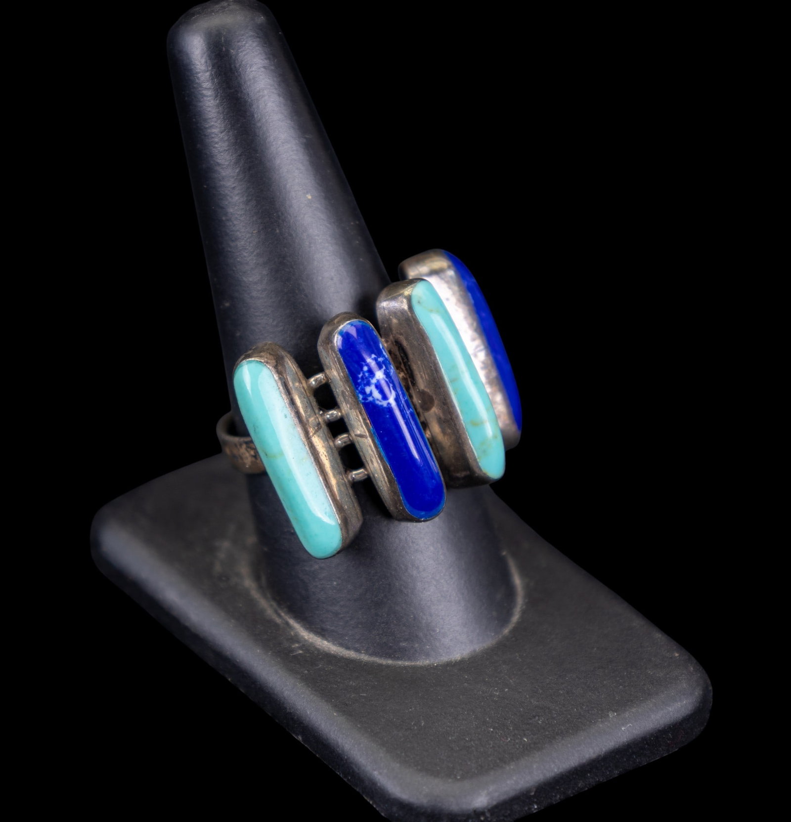 Lapis and Turquoise Ring: Large band-style ring set with large lapis and turquoise pieces in a modern style.