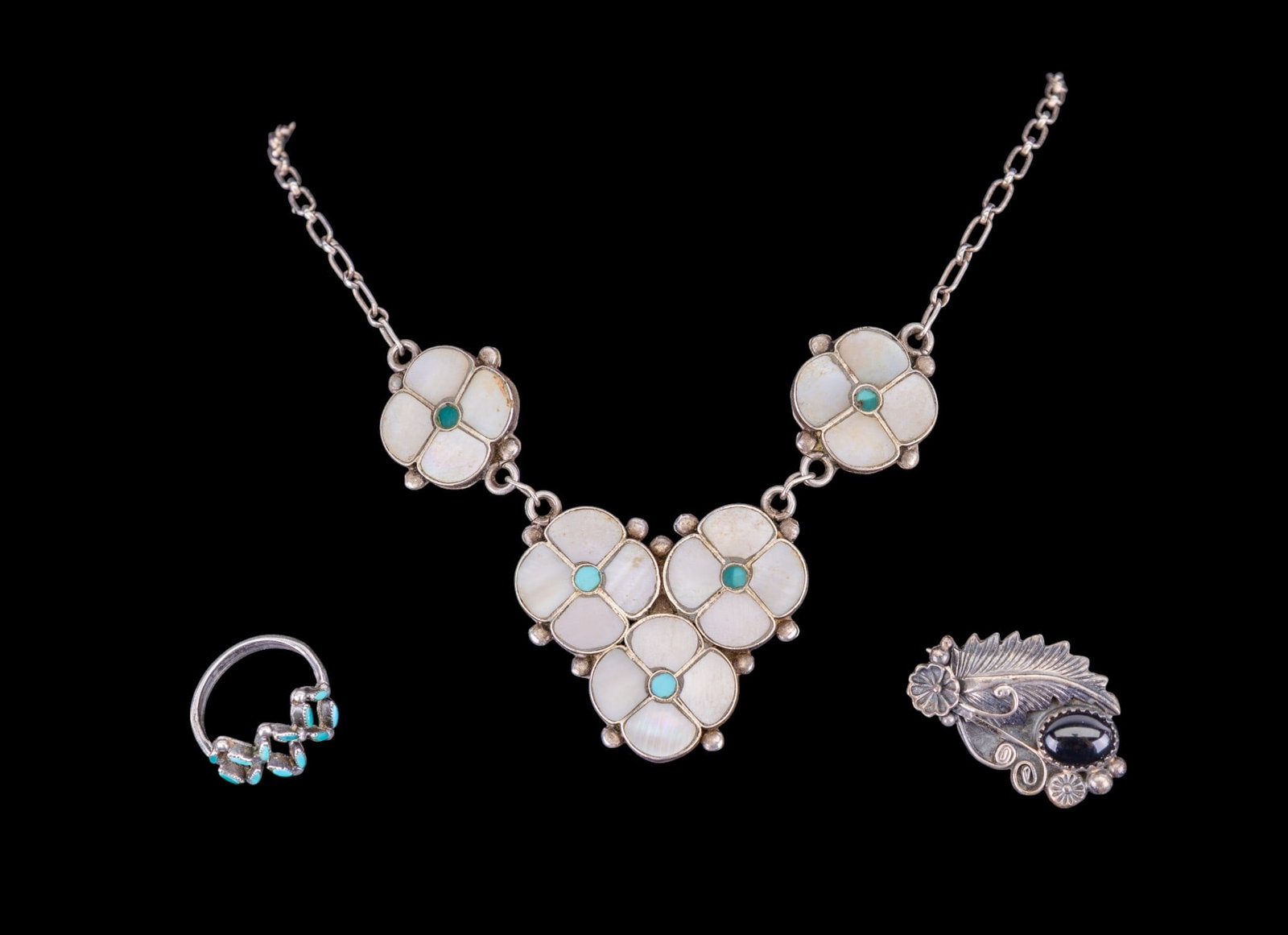 Native Necklace and More: Signed R. Bowkaye, Zuni necklace of floral design inlaid with mother of pearl and turquoise, a Zuni petit point ring and a silver with onyx detail brooch