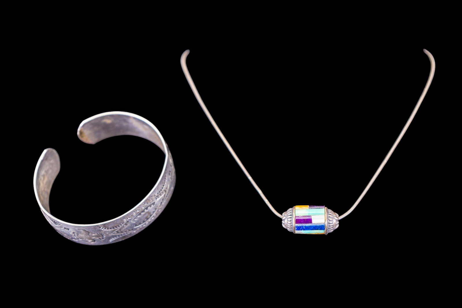 Silver Vintage Native American Jewelry: Includes a very early unsigned, unmarked hand etched cuff and a vintage sterling necklace with N.A. inlaid tubular bead.