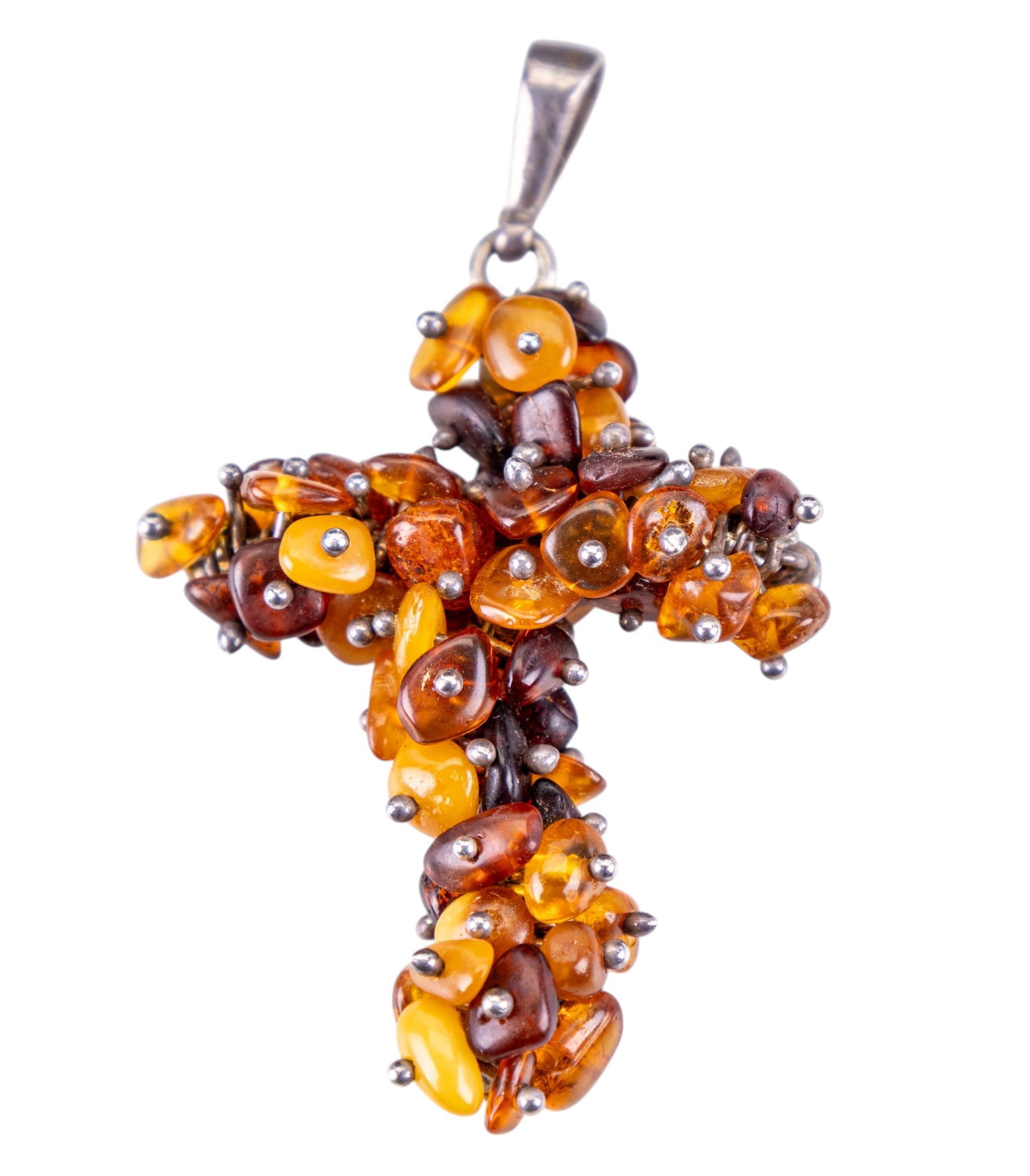 Amber and Sterling Silver Cross: Pendant made from clusters of amber set in sterling silver.