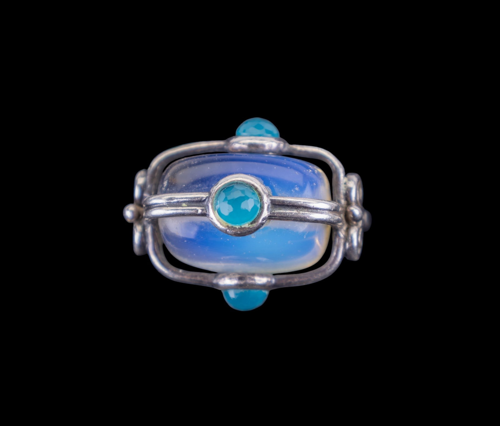 Unusual Sterling and Stone Ring: Sterling Silver handmade ring set with large polished opalite and blue faceted gemstones