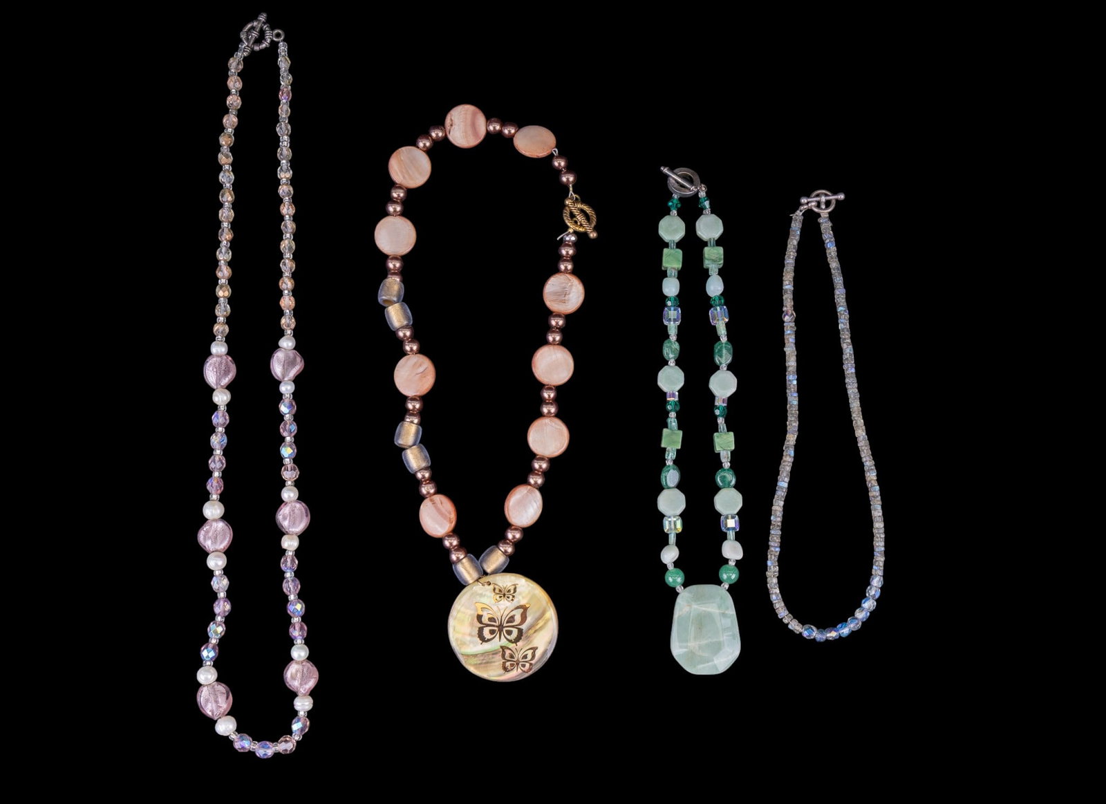 Pearl and Stone Necklaces: Include a labradorite necklace with sterling toggle clasp, pearl + crystal necklace, stone and butterfly necklace, geode pendant, and one other.