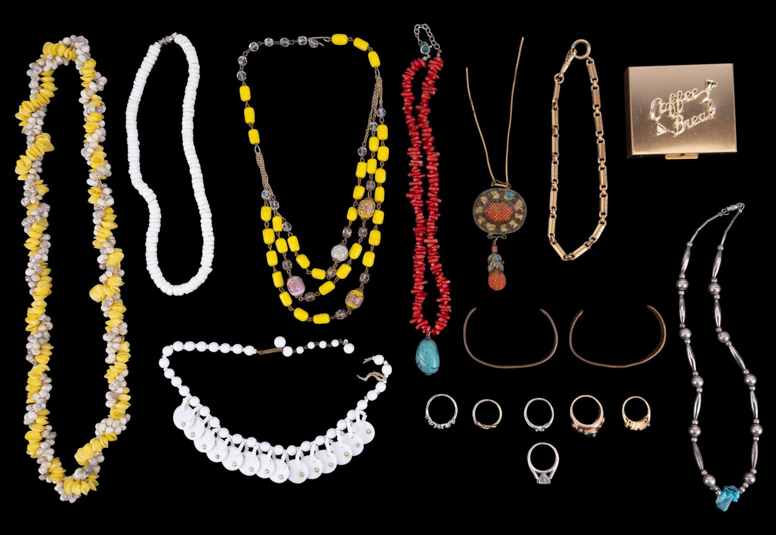 Vintage Compact & Jewelry: Includes a vintage "coffee break" compact, several necklaces including seashell, coral turquoise and others, as well as a selection of rings and a early Chinese coral pendant.