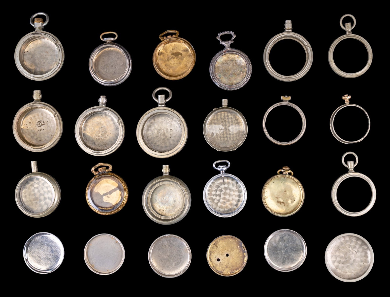 Pocket Watch Cases and Cases Parts: An assortment of antique and early pocket watch cases including Illinois and Crescent nickel cases, Philadelphia Silverode, backings, and bezels.
