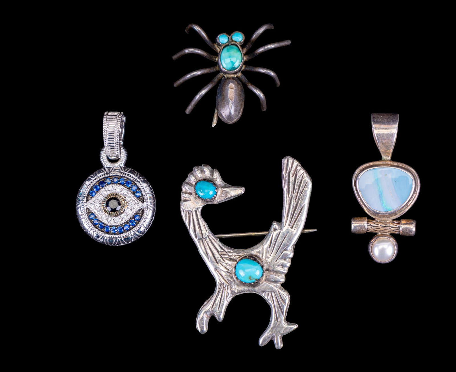 Vintage Sterling Jewelry: Includes Judith Ripka sterling and 18K evil eye pendant/charm, a boulder opal and pearl pendant and a native silver and turquoise road runner pin.