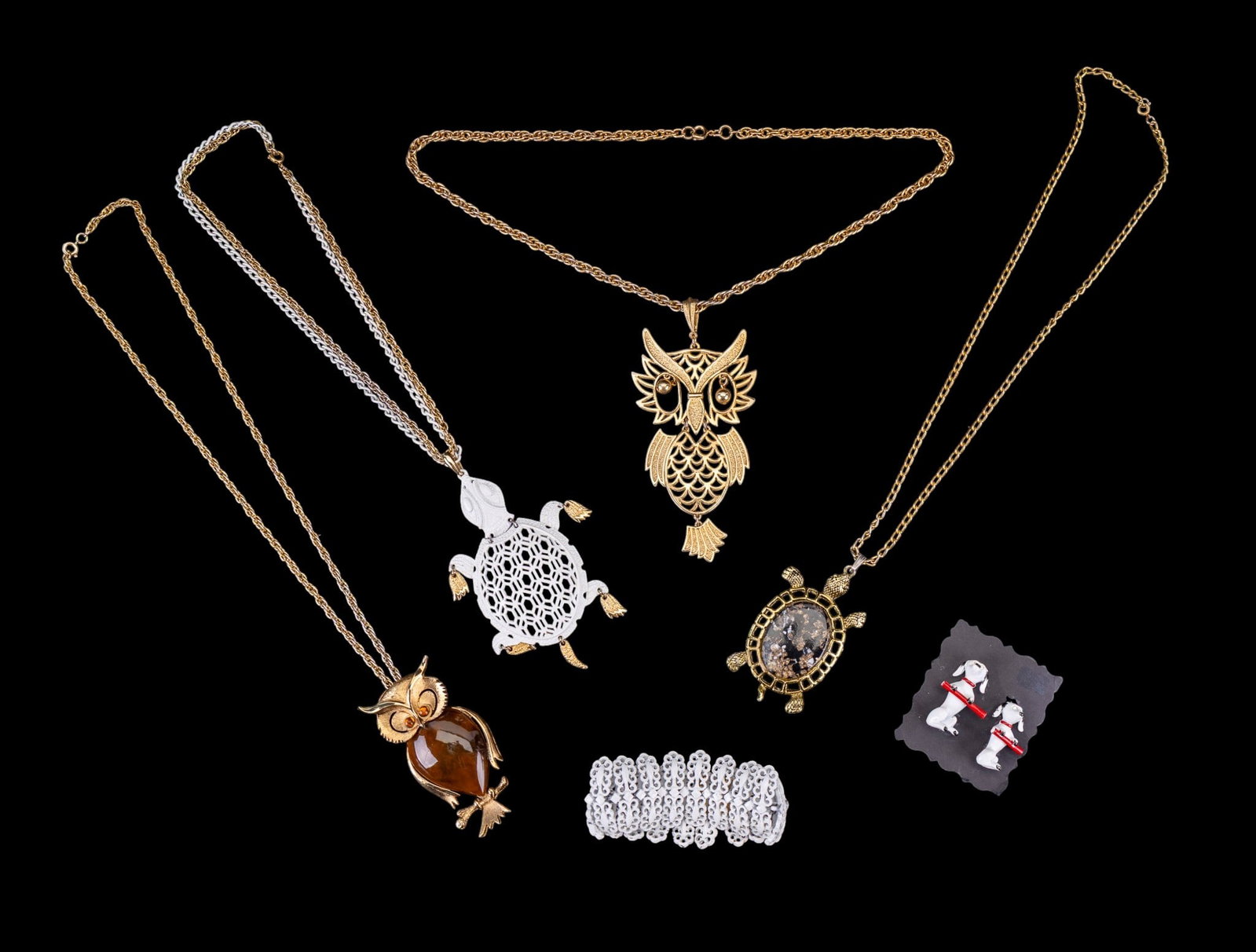 Turtle and Owl Vintage Jewelry: Includes two large owl necklaces and two large turtle necklaces (one in need of repair), a white Monet bracelet, as well as Gerry's Dalmatian duet pins.