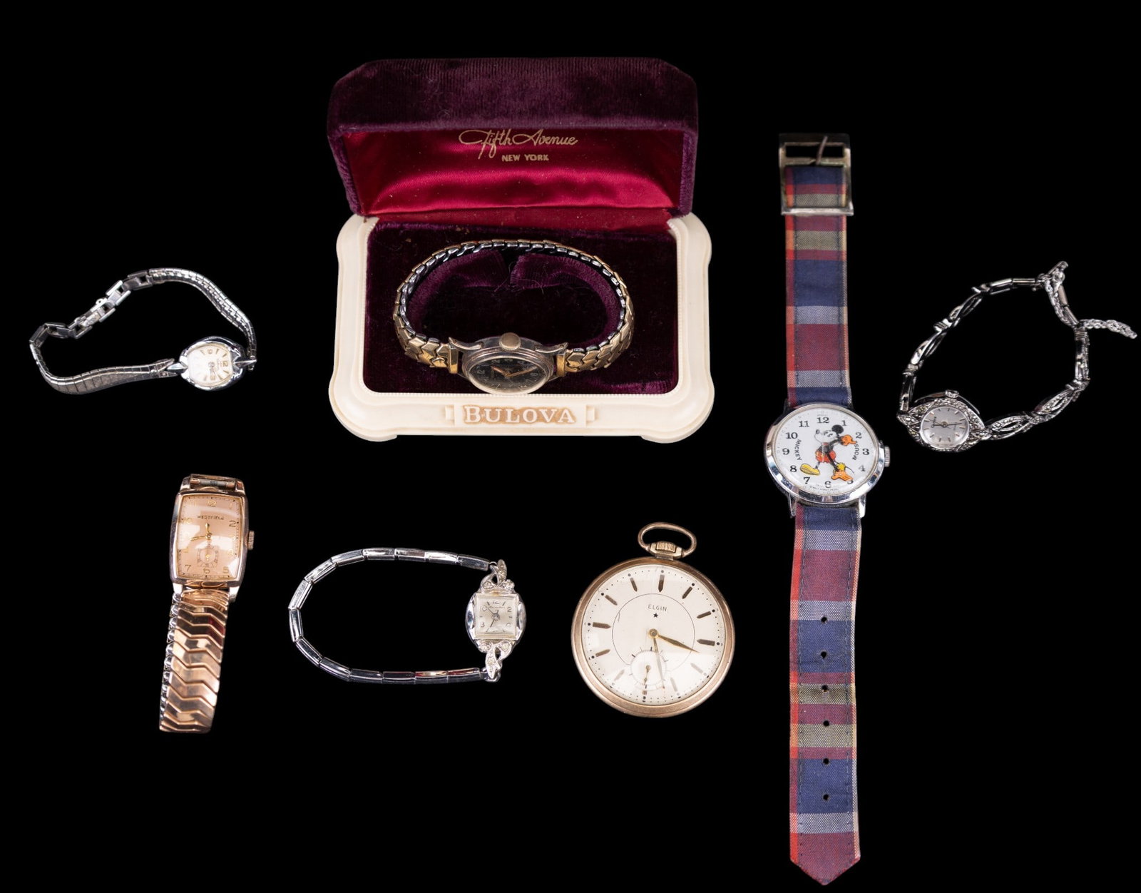 Vintage Watches: Includes a early Swiss Walt Disney Mickey Watch, a antique gold filled Elgin pocketwatch and a variety of vintage ladies wind up watches.