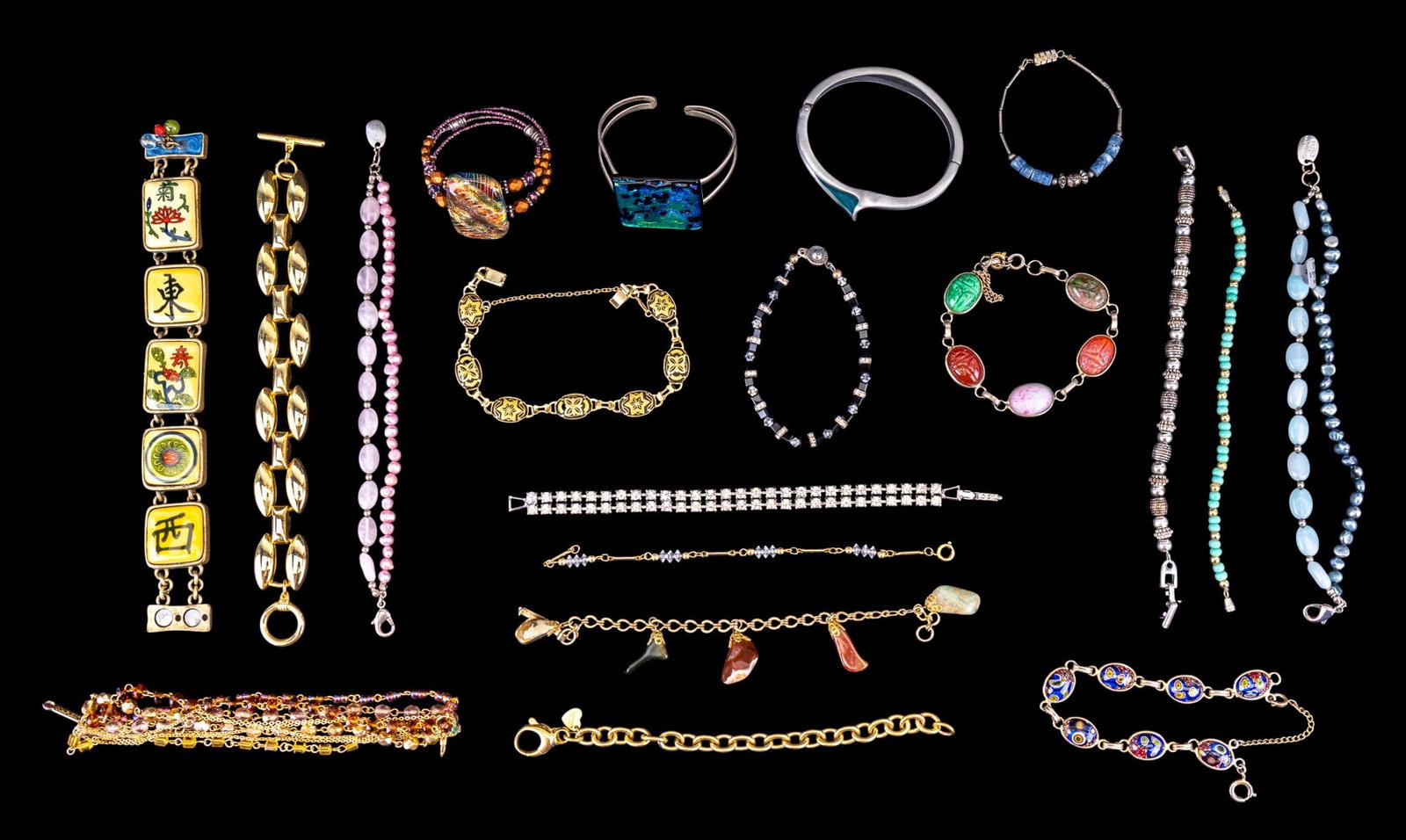 Pearl, Jade, and Other Costume Bracelets: A collection of costume bracelets including a blue jade and cultured pearl multistrand bracelet and a matching bracelet in pink, art glass cuff bracelets, and other styles such as Damask, millefiori, 