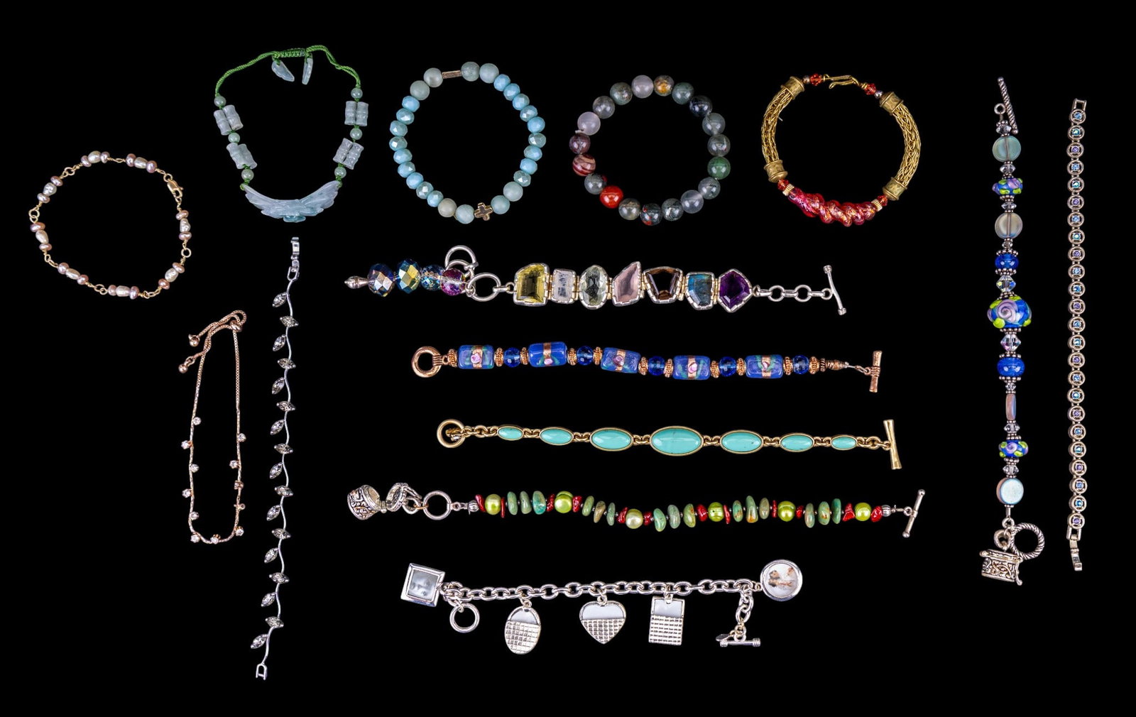 Art Glass, Natural Stone, and Rhinestone Bracelets: A collection of vintage bracelets featuring design elements such as cultured pearls, art glass beads, rhinestones, abraded jade, natural aquamarine, natural polished stone beads, miniature photo frame