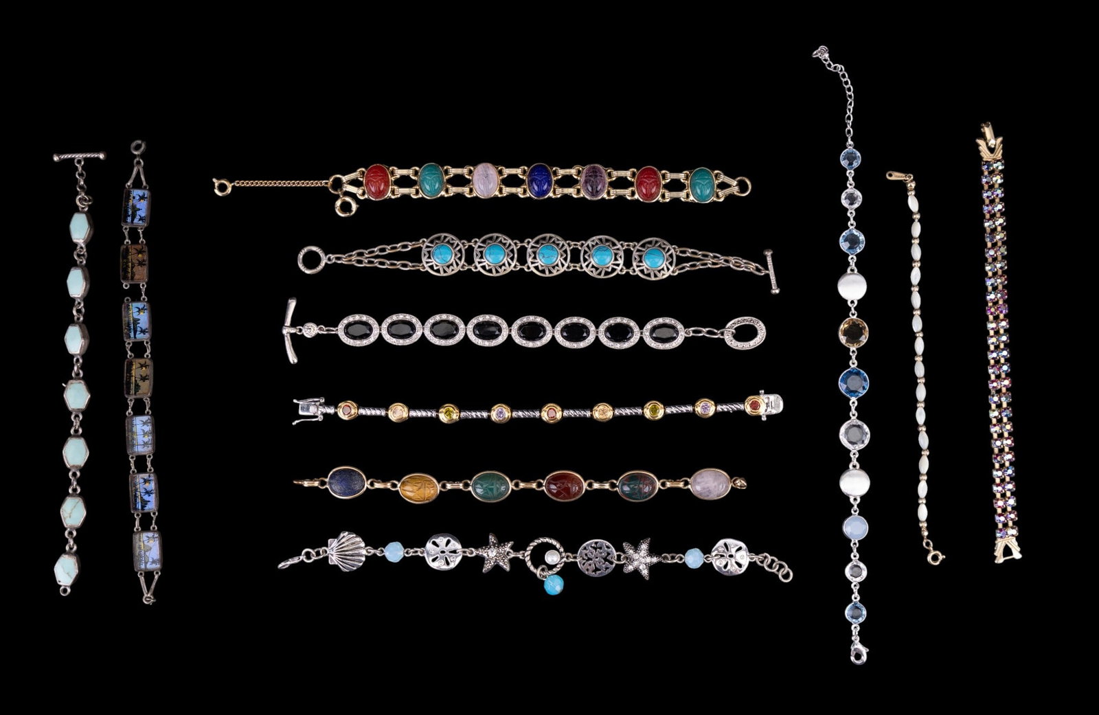 Sterling and Other Costume Bracelets: A collection of bracelets including a sterling silver panel bracelet with turquoise dyued howlite inlay, note '925' is very light, a Rio butterfly wing panel bracelet featuring a 'Silver 900' mark, a 