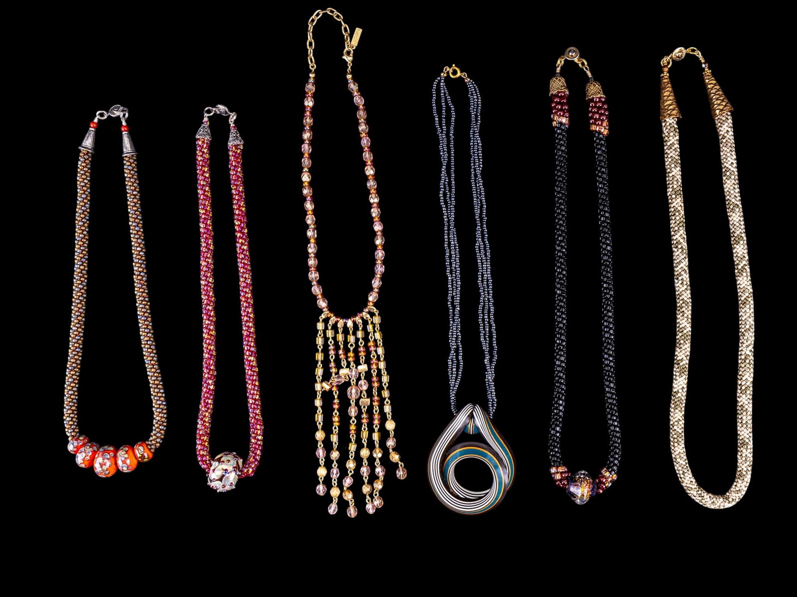 Artisan Beaded Necklaces and More: Artisan made hand strung necklaces featuring art glass and polymer pendants, a woven rope necklace, and a Napier facet bead necklace. Longest measures approx. 10.5" on the drop.