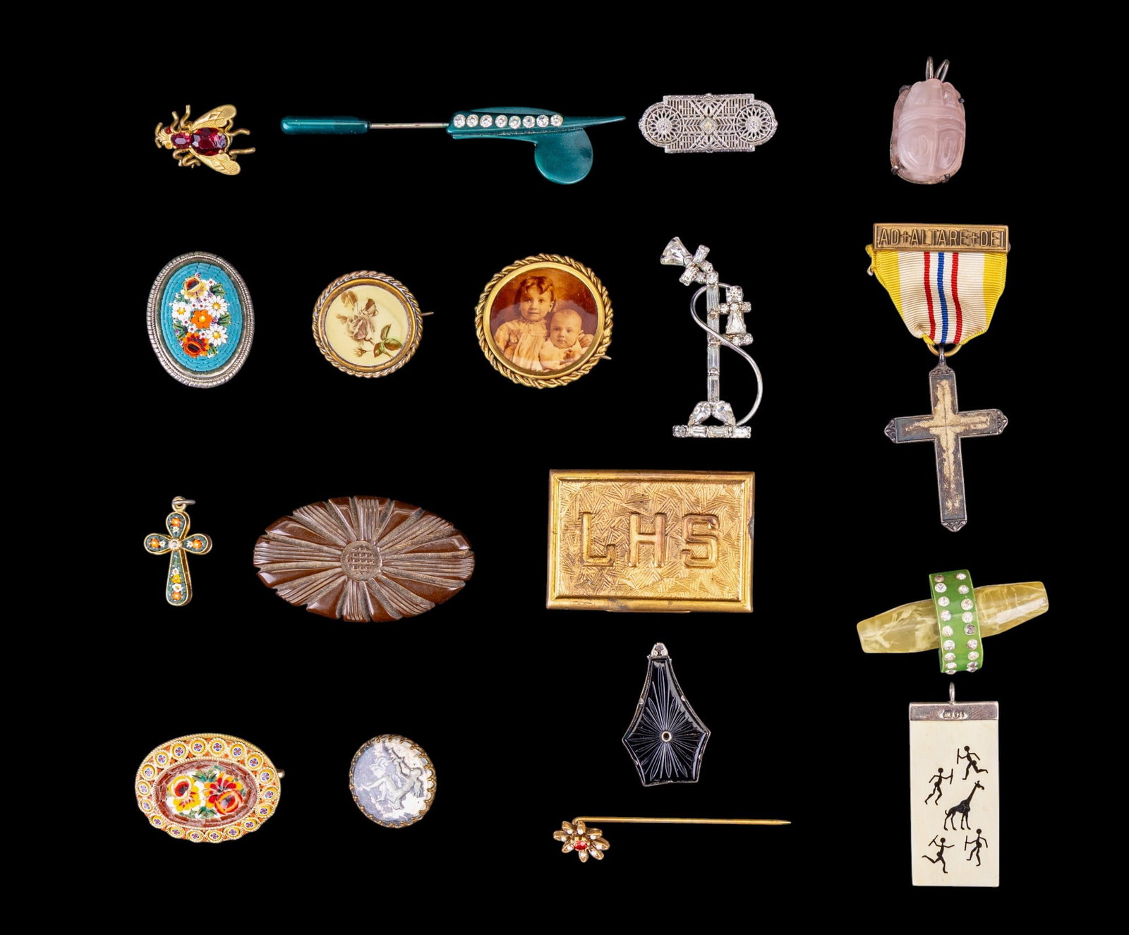 Mosaic, Bakelite, and Rhinestone Jewelry: A collection of vintage and Victorian style jewelry including micro mosaic brooches and Cross pendant, Victorian photograph brooch, carved rose quartz scarab pendant, Art Deco filigree brooch, carved 
