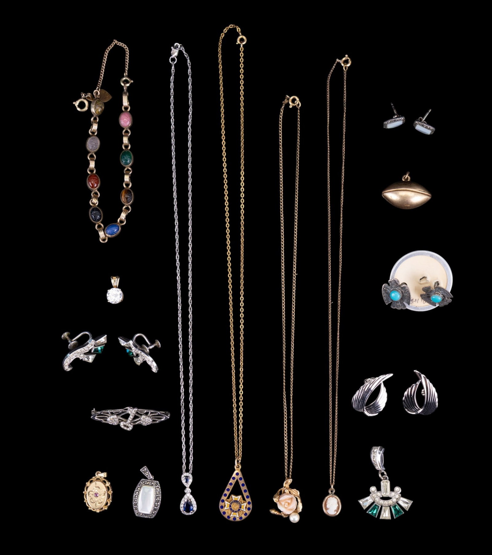 Sterling Silver and Gold Filled Jewelry: A collection of sterling silver and gold filled jewelry including a vintage clear and green rhinestone screw back earring and pendant set, sterling silver wing shaped studs, gold tone sterlng solitair