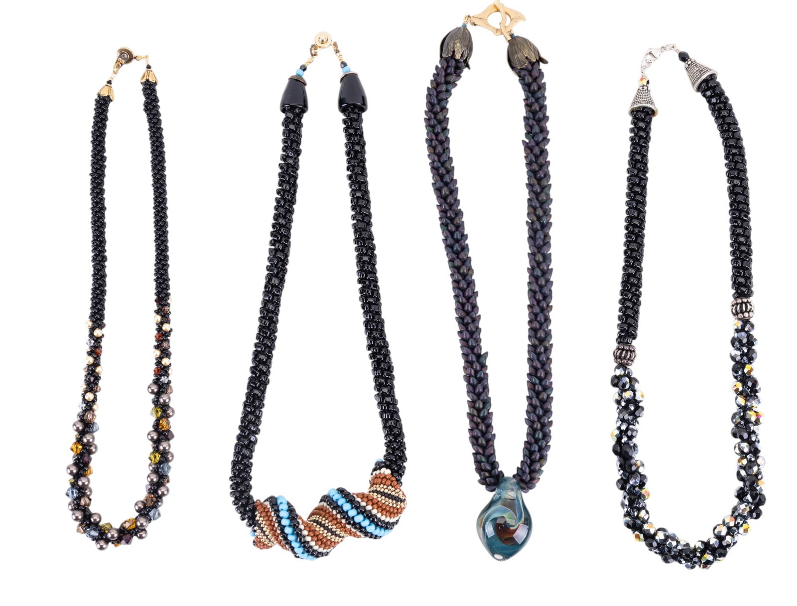 Artisan Glass Bead Necklaces: Four hand strung artisan crafted glass bead necklaces featuring facet cut beads, matte and glossy glass beading, and one necklace featuring a blown swirl art glass pendant. Longest measures approx. 9"