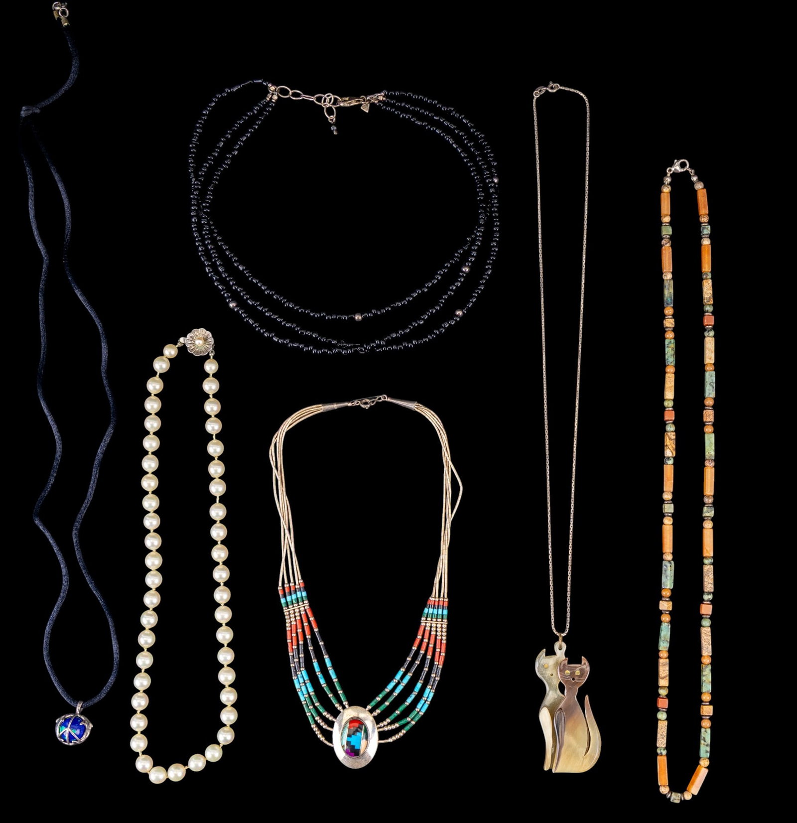 Sterling Silver Stone and Pearl Necklaces: A collection of necklaces including a liquid silver sterling silver necklace with turquoise, coral, and onyx cabochon, a multistrand obsidian bead necklace with sterlings stations and clasp, a strand 