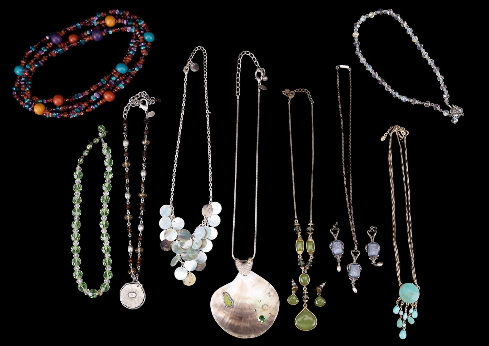 Cut Crystal and Other Beaded Necklaces: A collection of vintage costume necklaces including a green and clear facet cut crystal bead necklace, an iridescent facet cut crystal bead necklace, an opera length multicolor acrylic bead necklace, 