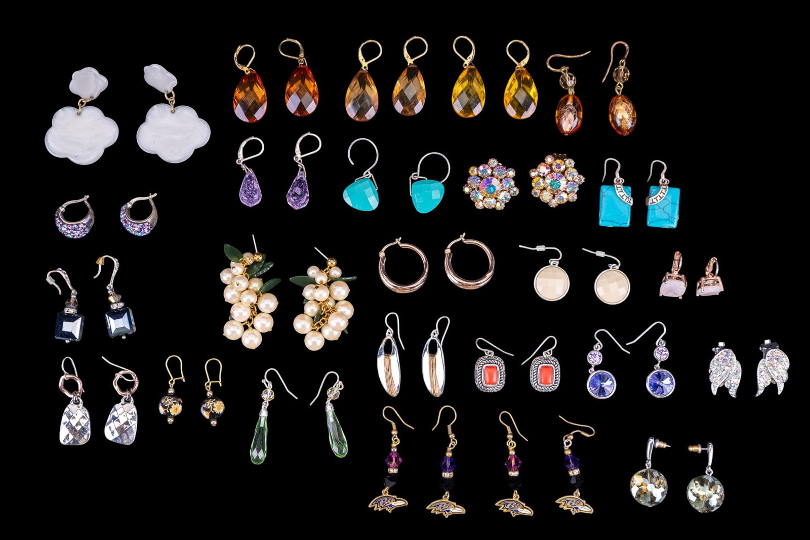 Joan Rivers, Sarah Coventry, & Other Earring Pairs: Three pairs of amber colored teardrop facet cut style acrylic dangle earrings by Joan Rivers, a pair of sterling and teardrop facet cut pale amethyst dangle earrings, silver tone and iridescent rhines
