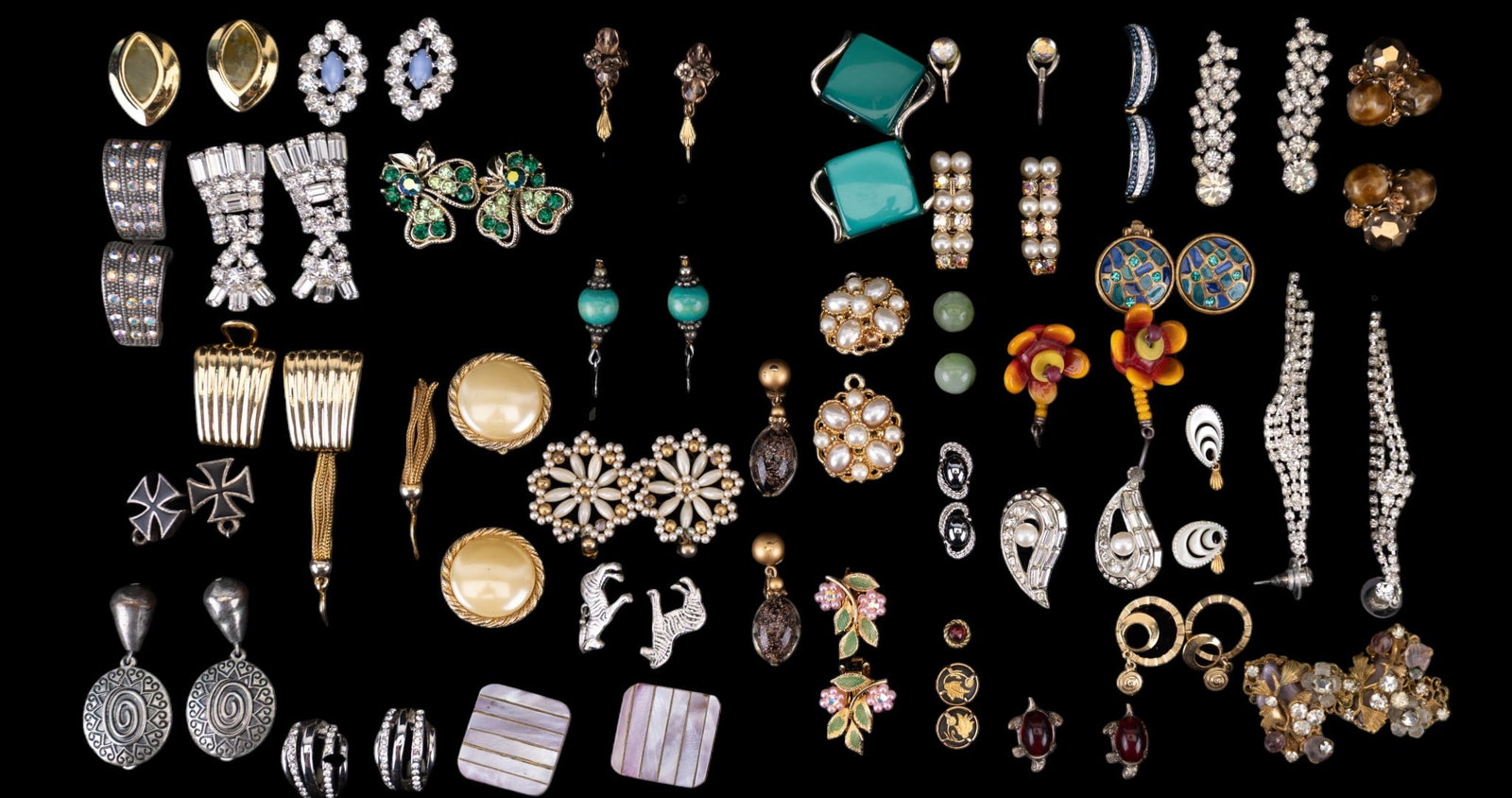 Vintage Designer and Costume Earring Group: A collection of vintage designer costume earrings including brands such as Marvella, Liz Claiborne, Robert, Vogue, and others, and including a pair of sterling silver French hook earrings, and others.