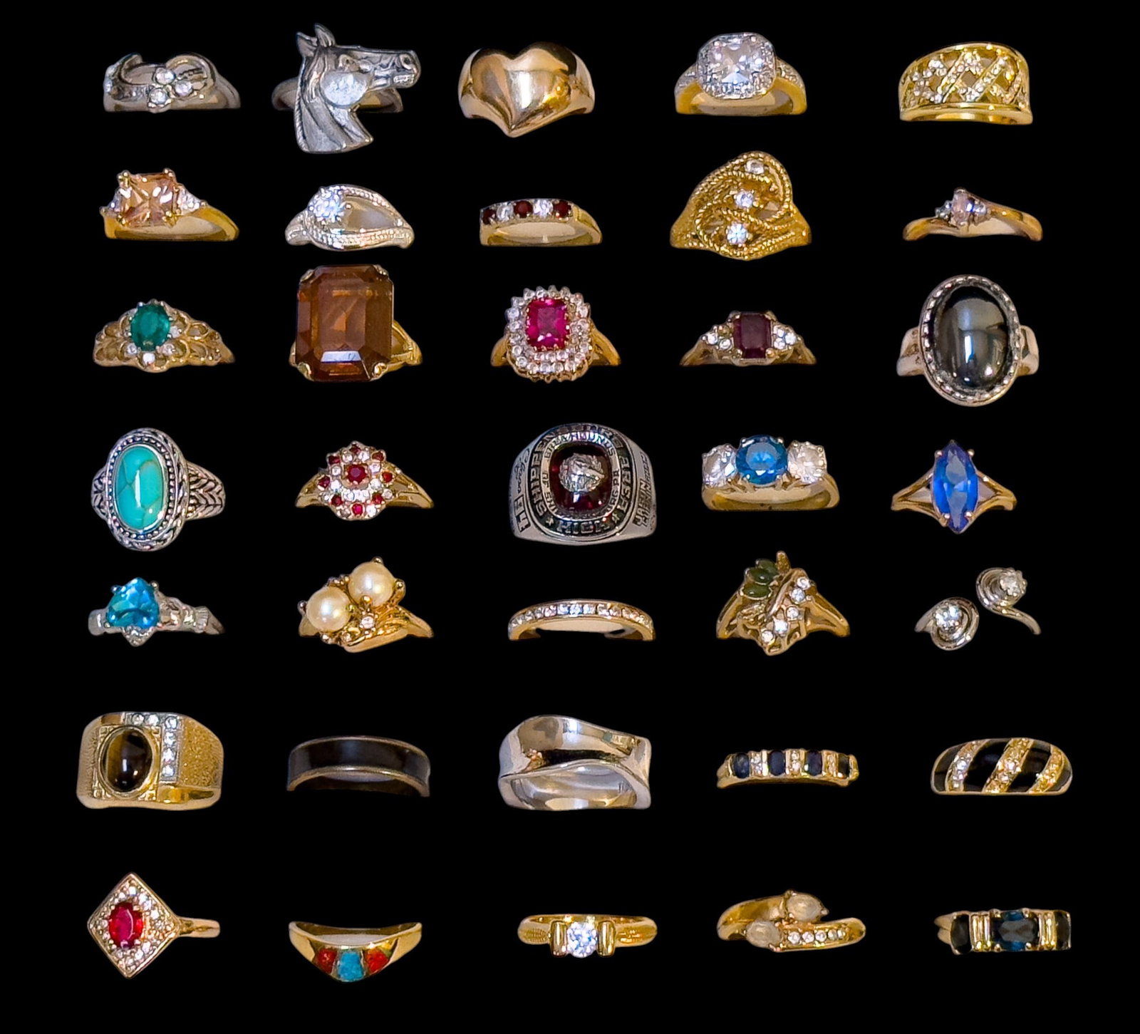 Gold Filled, Plated & Other Costume Rings (35): A collection of 35 costume rings featuring rhinestones, faux pearls, enamel, stone inlay and more, some are stamped 18K GF or 18K HGE, sizes range from 6 to 9.