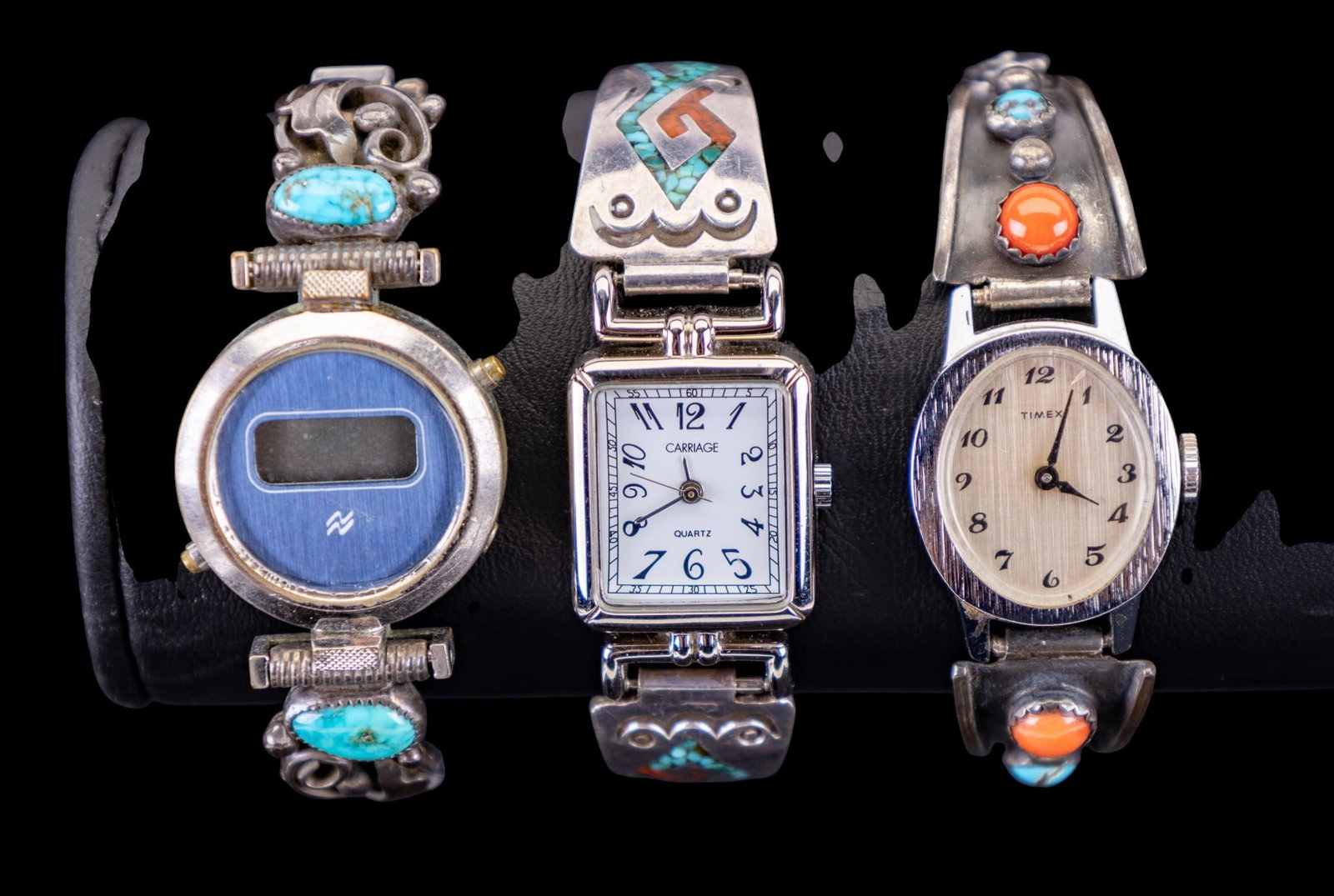 Native Style Wrist Watches (3): Three wrist watches featuring Native style band accents with turquoise and coral inlay and cabochons, one set is marked 'L. C. Navajo'.
