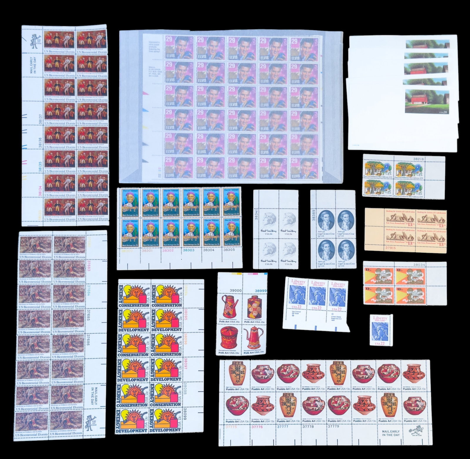 United States Postage Stamp Sheets: A collection of uncirculated U.S. Postage stamp sheets including commemorative Elvis Presley, Harriet Tubman, and others in denominations of 13 cents, 15 cents, 20 cents, 22 cents, and 29 cents.