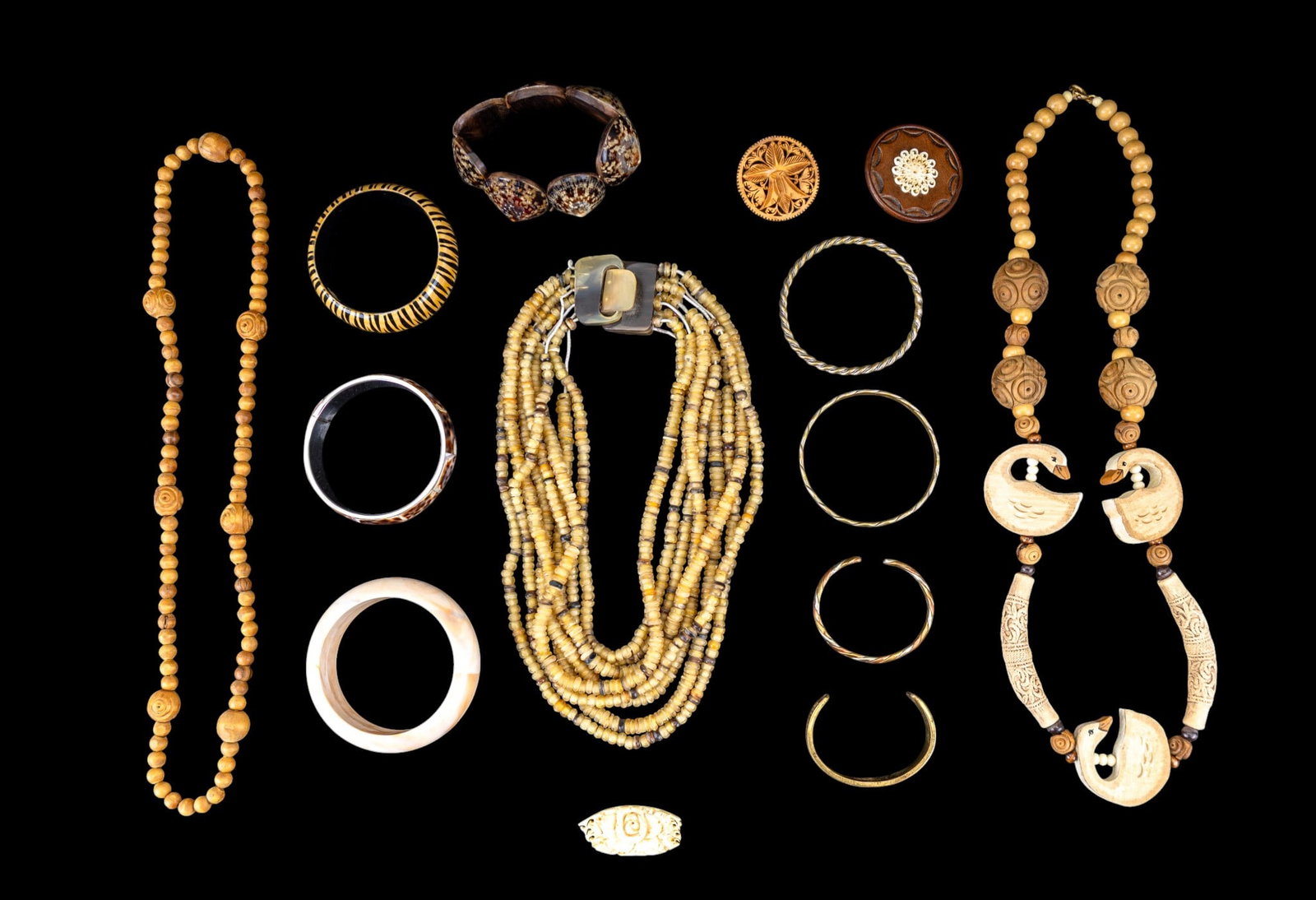 Wood, Shell, and Leather Jewelry: Necklaces, bracelets, and pins featuring a 28" olive wood bead necklace brought back from the Holy Lands by my Grandfather in the 1970's, a 7 shell (owl limpet) stretch bracelet, a 3/4" wide shell ban