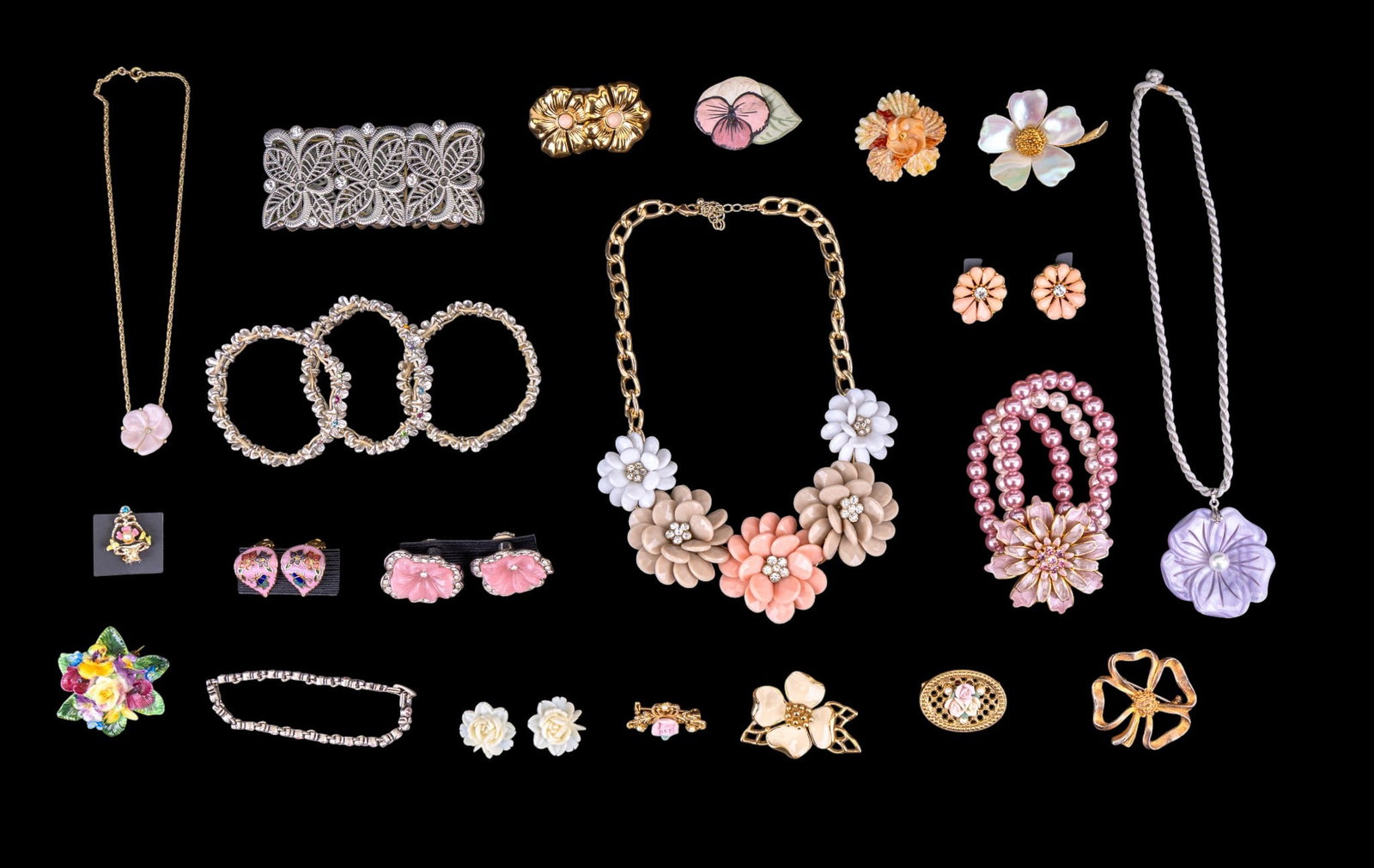 Flower Themed Jewelry: Twenty-four pieces of flower themed jewelry including a Crown Staffordshire made in England porcelain pin, a mother-of-pearl and gold tone 2" Mandle pin, a 1 3/4" glass flower pendant with center cult