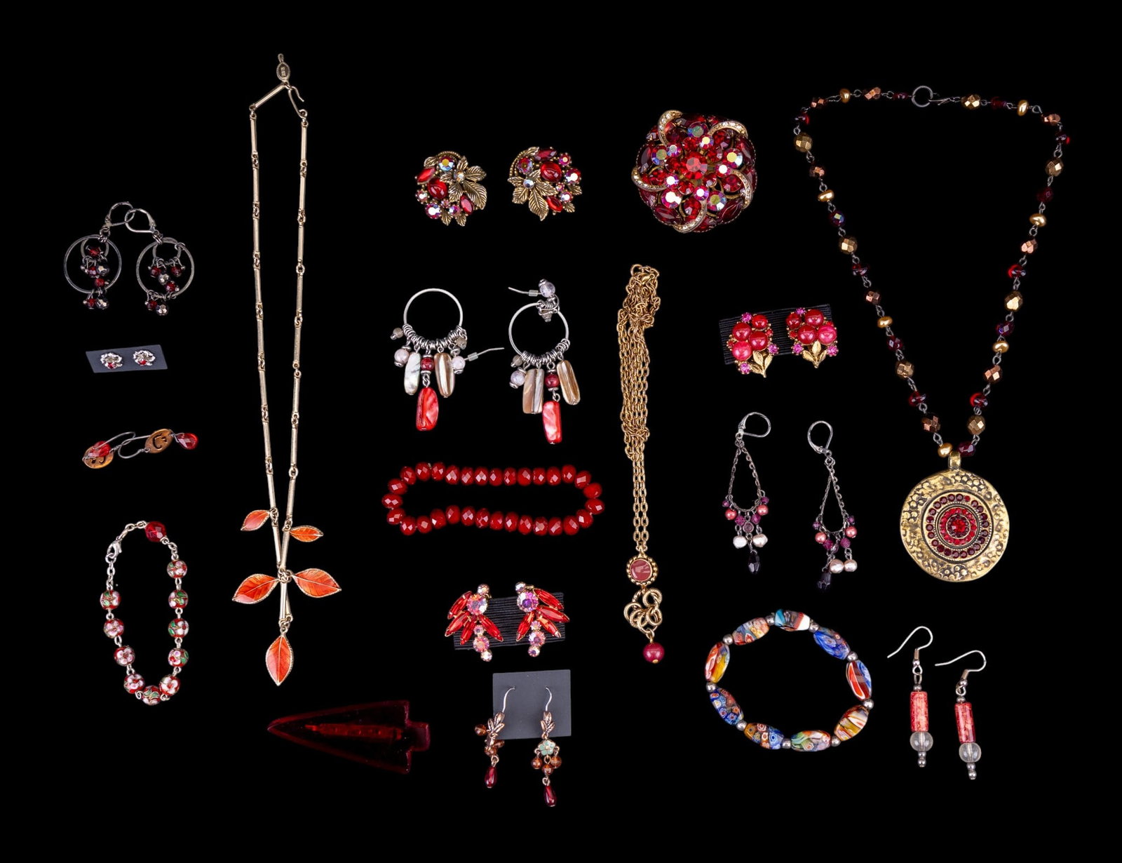 Red Costume Bling Jewelry: Red costume sparkly jewelry some of which are vintage. This group features a 2" multi-layered and pronged rhinestone brooch (it bears the riveted back construction of a Judy Lee 1960's piece), a pair