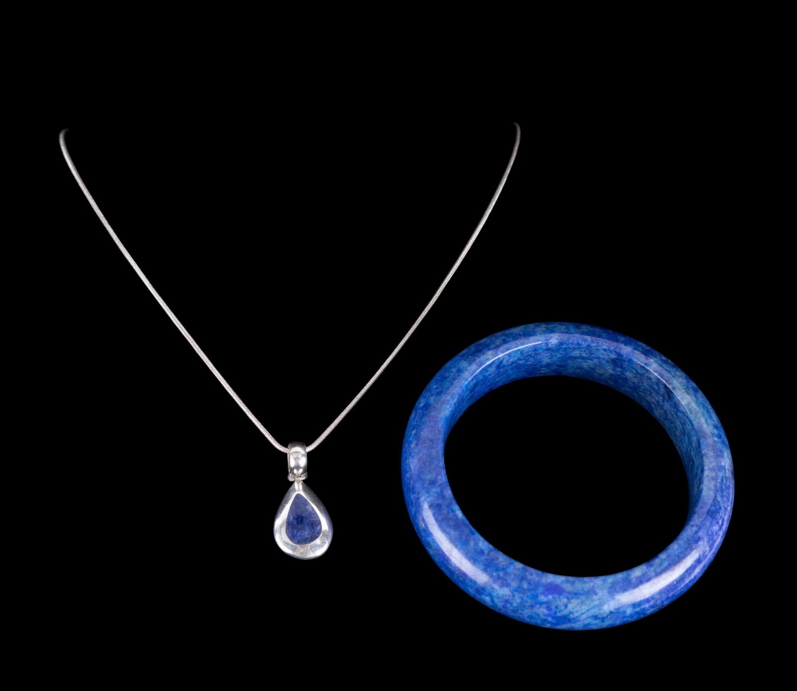 Sterling and Lapis Lazuli Jewelry: A stunning 18mm wide lapis lazuli gemstone bangle bracelet measures 80mm outside and 62mm inside. (94.7 gms) This bracelet is made from a single stone - Fabulous! Bracelet is paired with an 18"