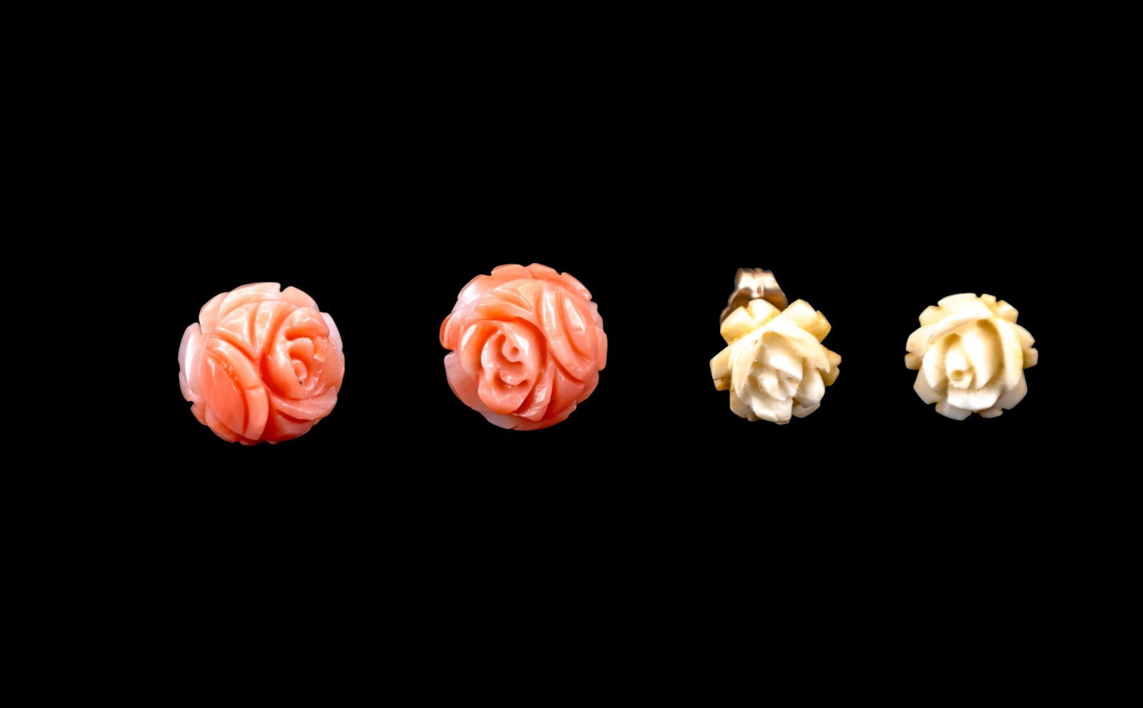Coral and 14K Gold Earrings: Pair of rose carved coral and 14K gold stud earrings. Also included is a pair of rose carved bone stud earrings. Both pairs of earrings have 14K gold backs.