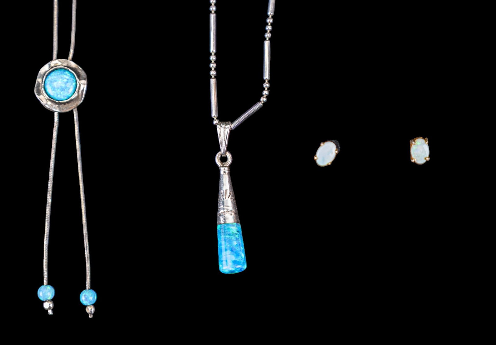 Opal and Sterling Jewelry: A Noa Zuman artisan opal and sterling silver bolo style necklace (approx. 19"and marked 925 Italy). In addition there is a 24" ball and tube link sterling chain necklace with a 1" sterling and opal pe