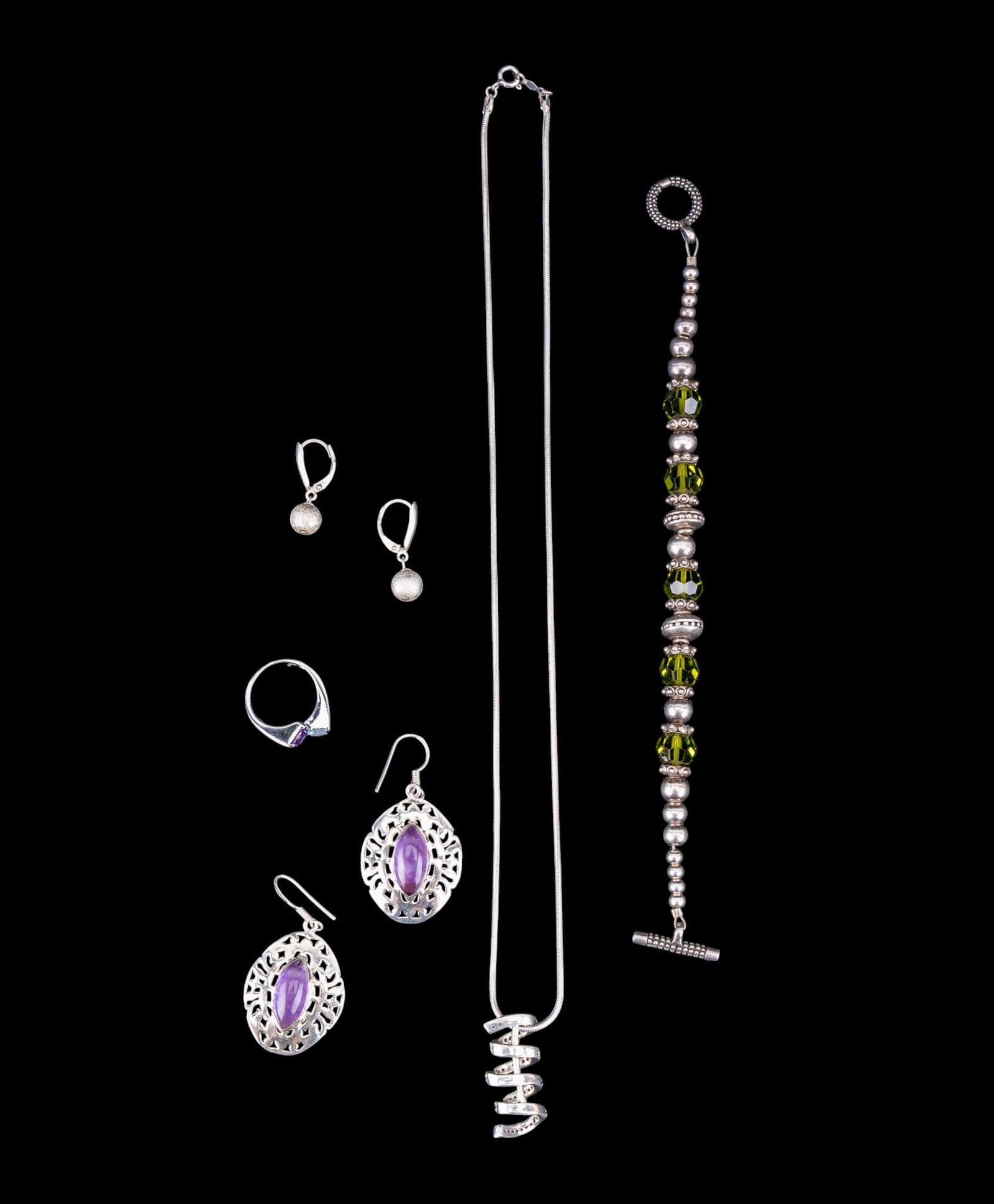 Sterling Silver Jewelry Collection: Sterling silver jewelry collection featuring a beautiful sterling silver and amethyst openwork 2" drop pair of pierced earrings, a pair of matte finished sterling silver drop ball pierced earrings, a 