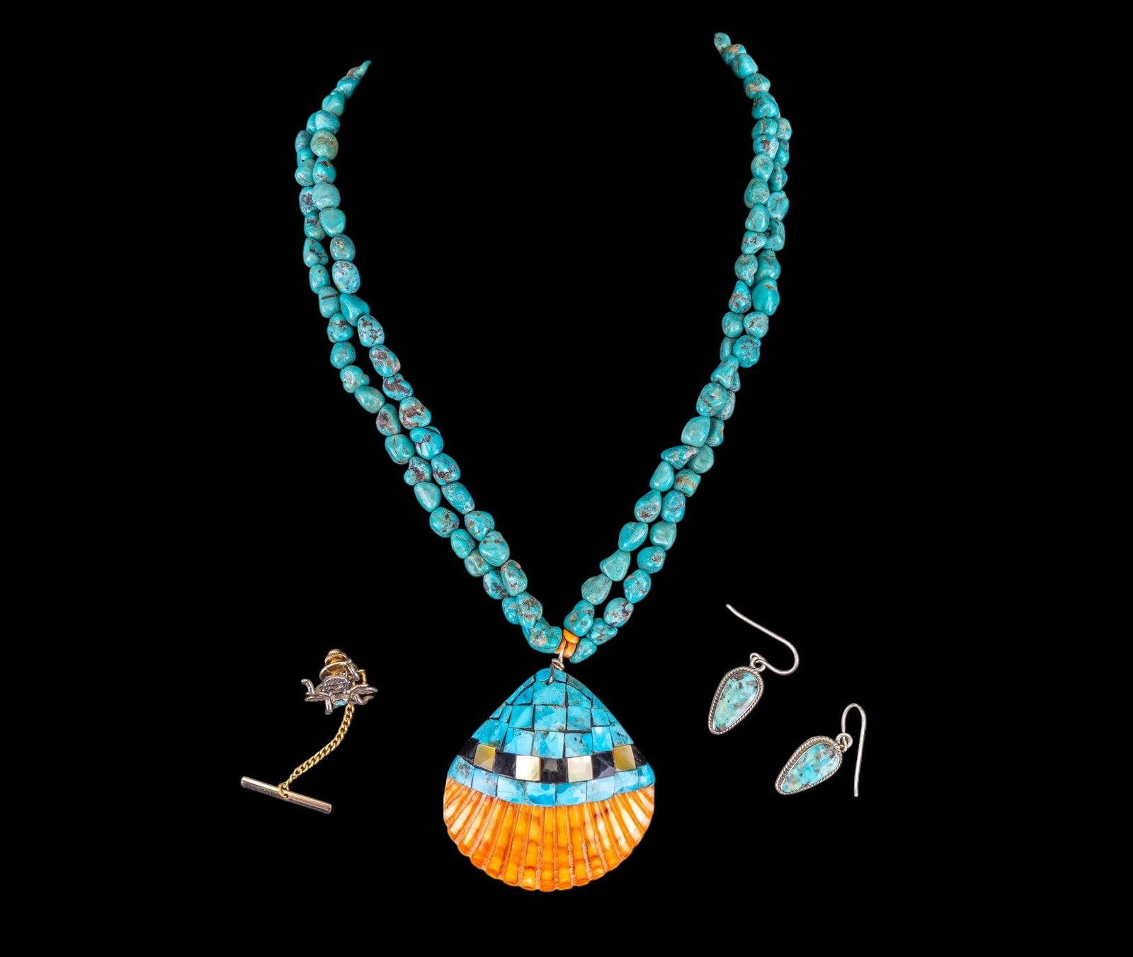 Turquoise and Shell Jewelry: A double strand turquoise nugget necklace featuring a scallop shell encrusted in turquoise, mother of pearl, and onyx with sterling caps, turquoise cabochon sterling French hook earrings, and an insec
