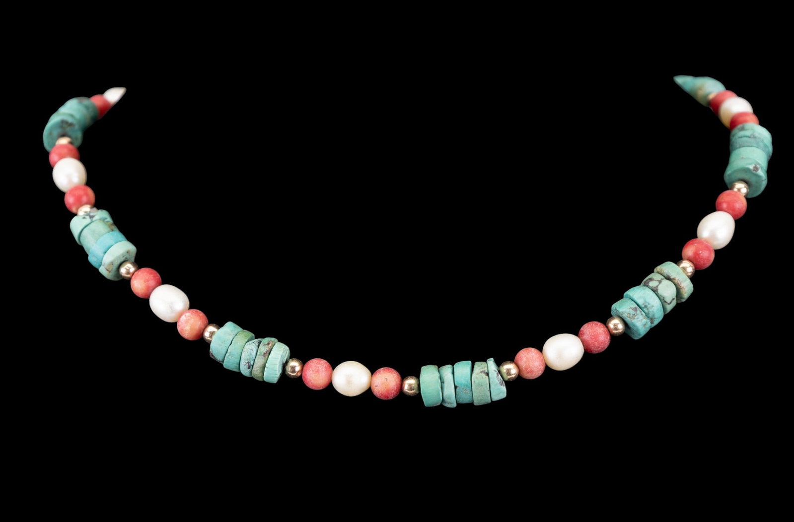 14K Gold Clasp Pearl Coral Turquoise Bead Necklace: A beaded necklace featuring turquoise disk, red coral, pearl, and 14K gold beads along with a 14K gold fishhook clasp. Necklace measures approx. 17.5" long.