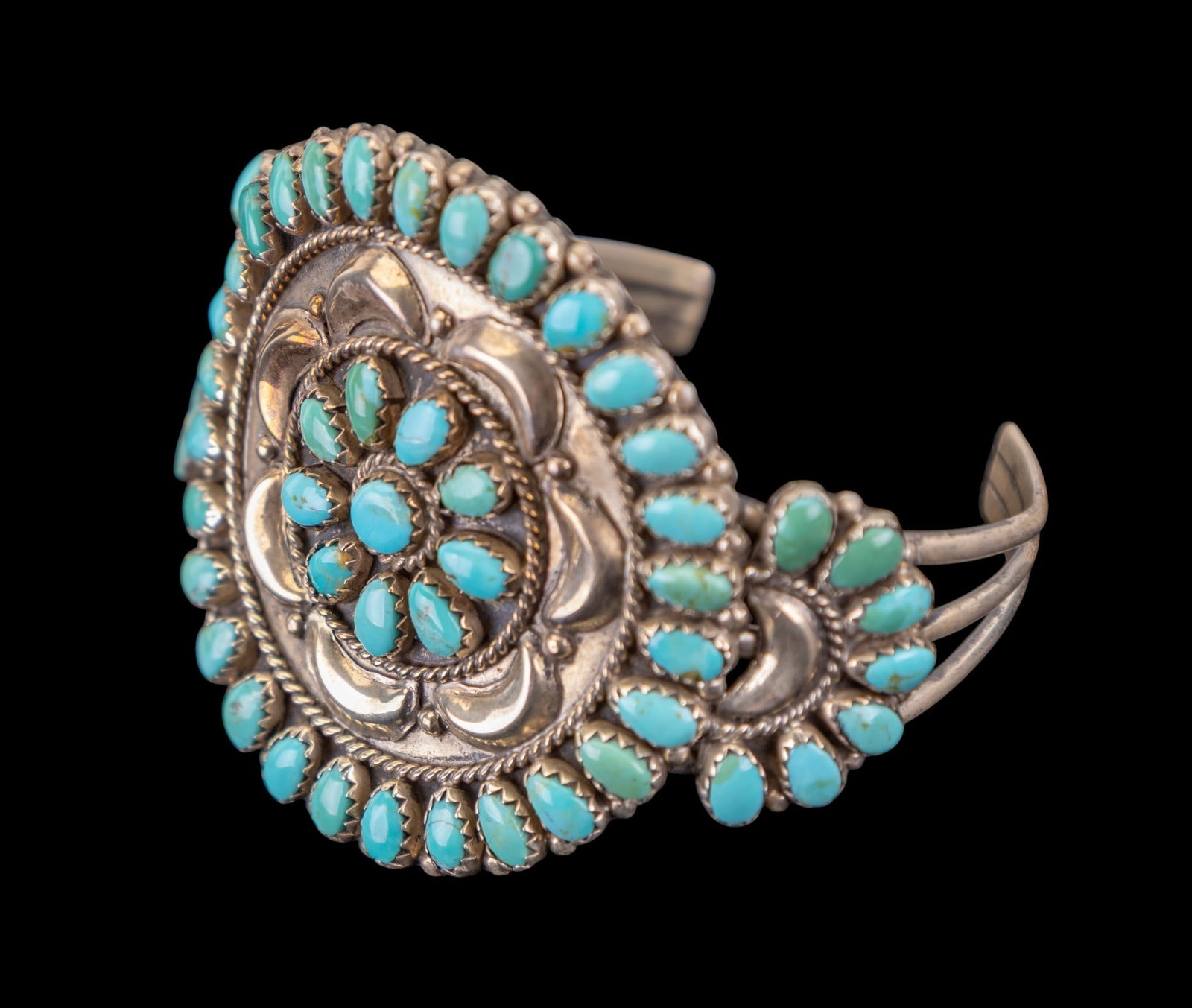 Marco Begaye N.A. Sterling Turquoise Bracelet: A native sterling and turquoise bracelet made and hallmarked by Marco Begaye, a Navajo artist. Bracelet measures approx. 2.5" across.