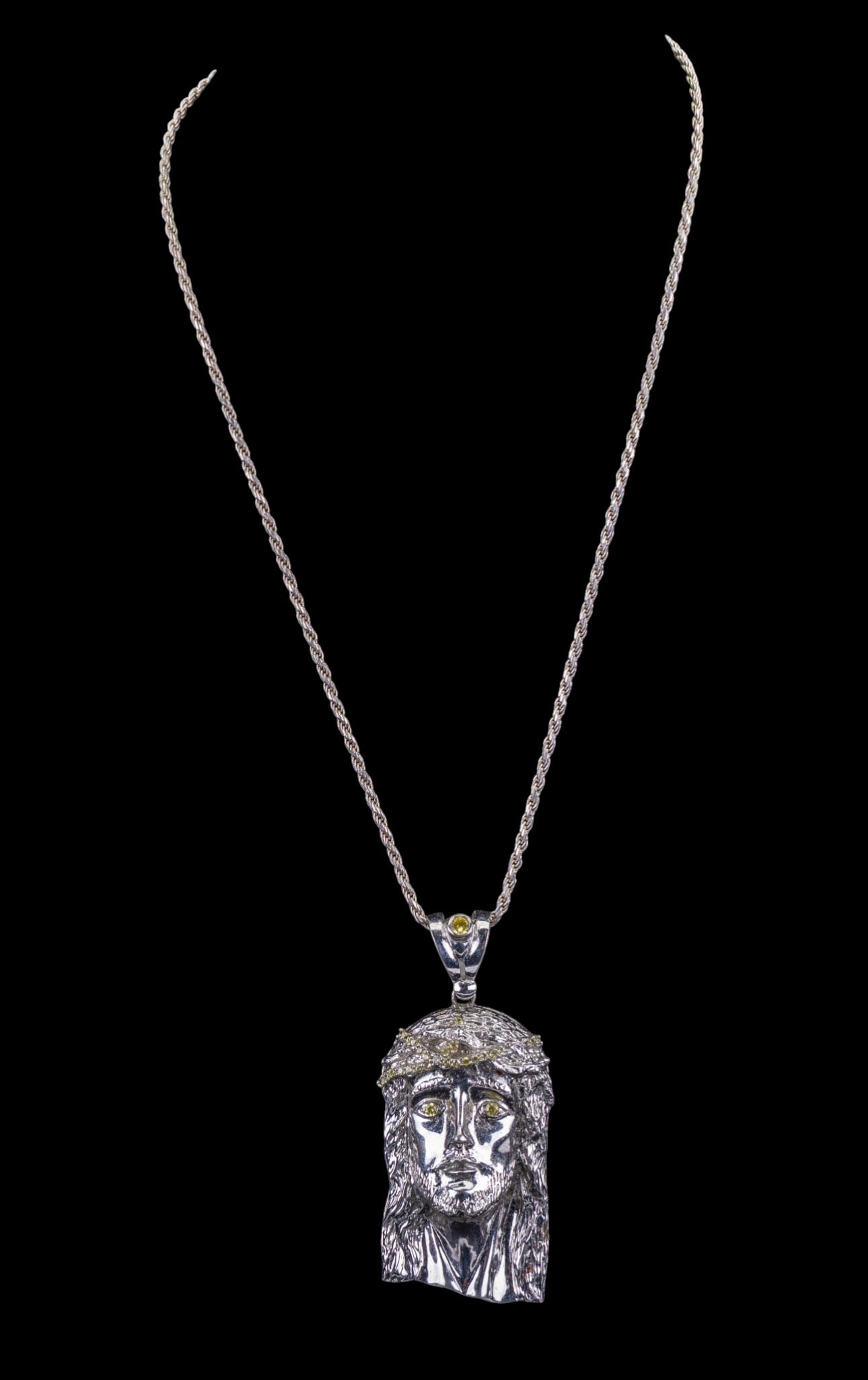 Sterling Silver Jesus Pendant Necklace: Large Jesus pendant with yellow crystal detail, .925 and a sterling silver rope chain necklace, approx. 2.20 ozt. NOTE - New buyers will have to pay with certified payment method like wire transfer,