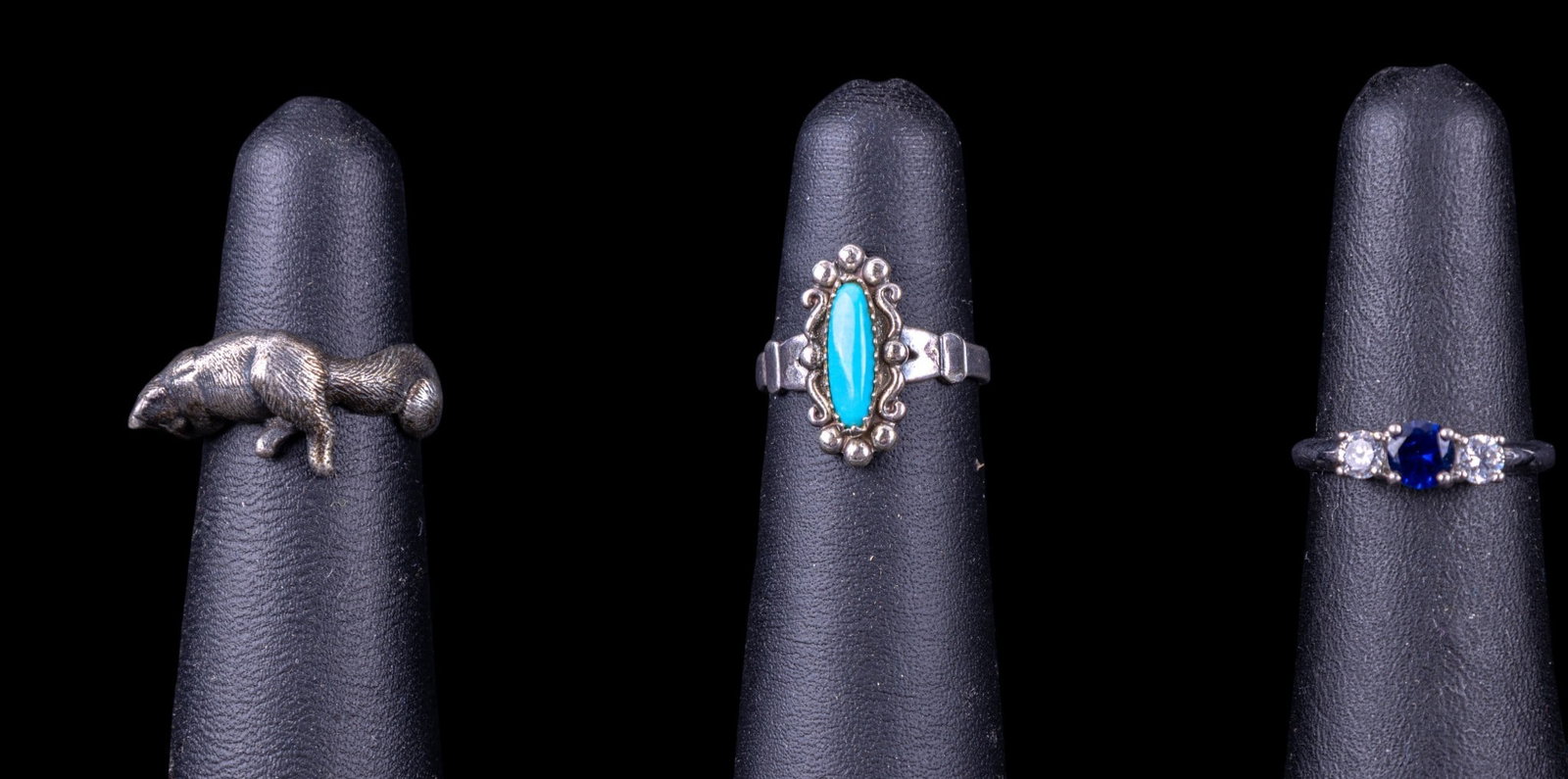 Sterling Silver Rings (3) w/ Accents: Sterling silver 3 dimensional cat ring, a turquoise ring and a sapphire style ring. Sizes range from 4.5 to 6, approx. total weight is .3 ozt.