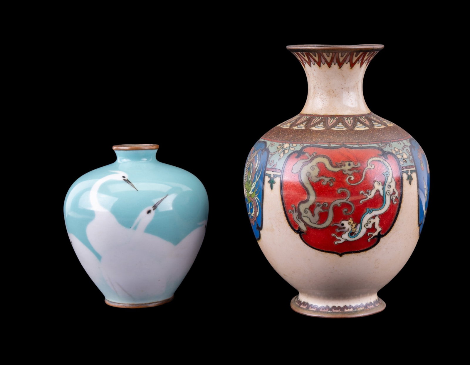 Japanese Cloisonne and Enamelled Vases (2): A Japanese colorful cloisonne vase featuring a dragon and phoenix motif, note a repair to one dragon medallion section, measures approx. 5.5" H, and a pale blue green enamel vase depicting white crane