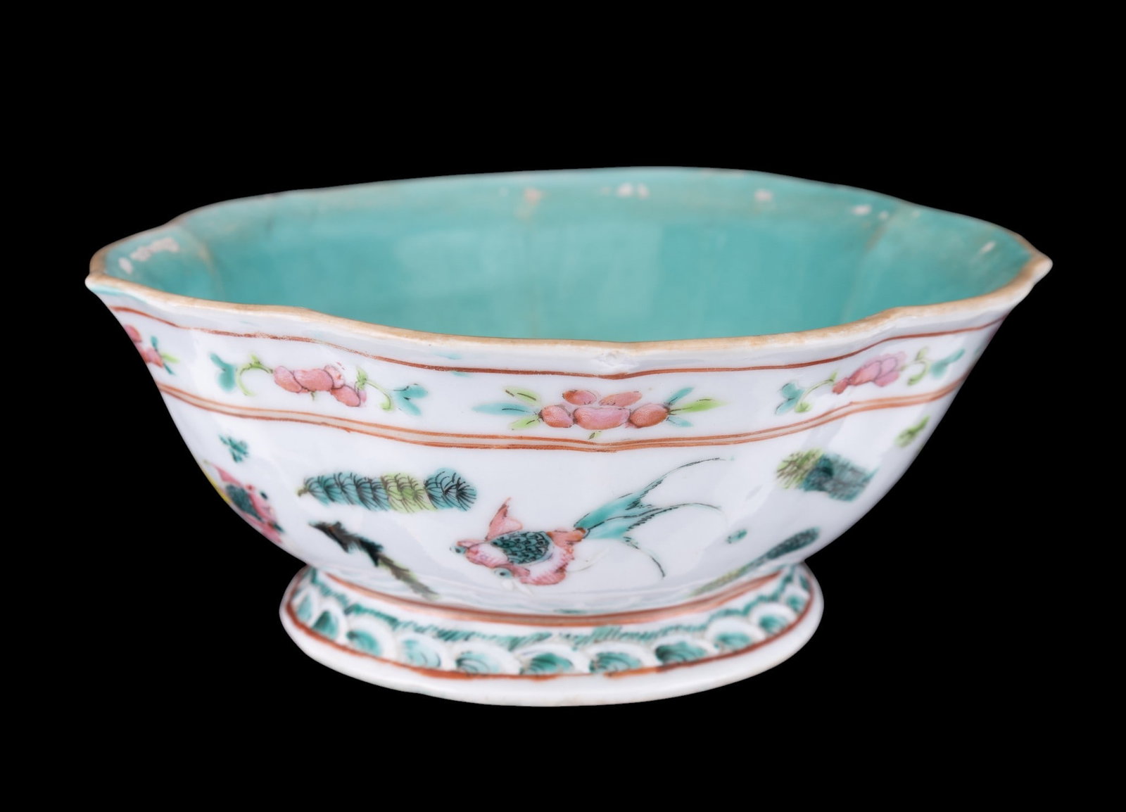 Chinese Porcelain Scalloped Footed Bowl: Chinese porcelain scalloped footed bowl, featuring famille rose-style floral and fish decoration with turqouise glazed interior and underside. Red square seal mark to base. Scalloped rim with pedestal