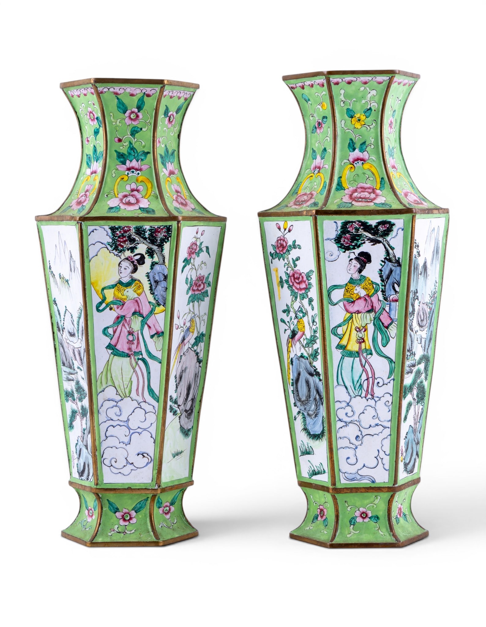 Pair of Chinese Enameled Hexagonal Vases: Pair of Chinese enameled metal hexagonal baluster vases, each hand painted with alternating figural, landscape, and bird panels against a green floral-decorated ground. Each measures approx. 14.5" H. 