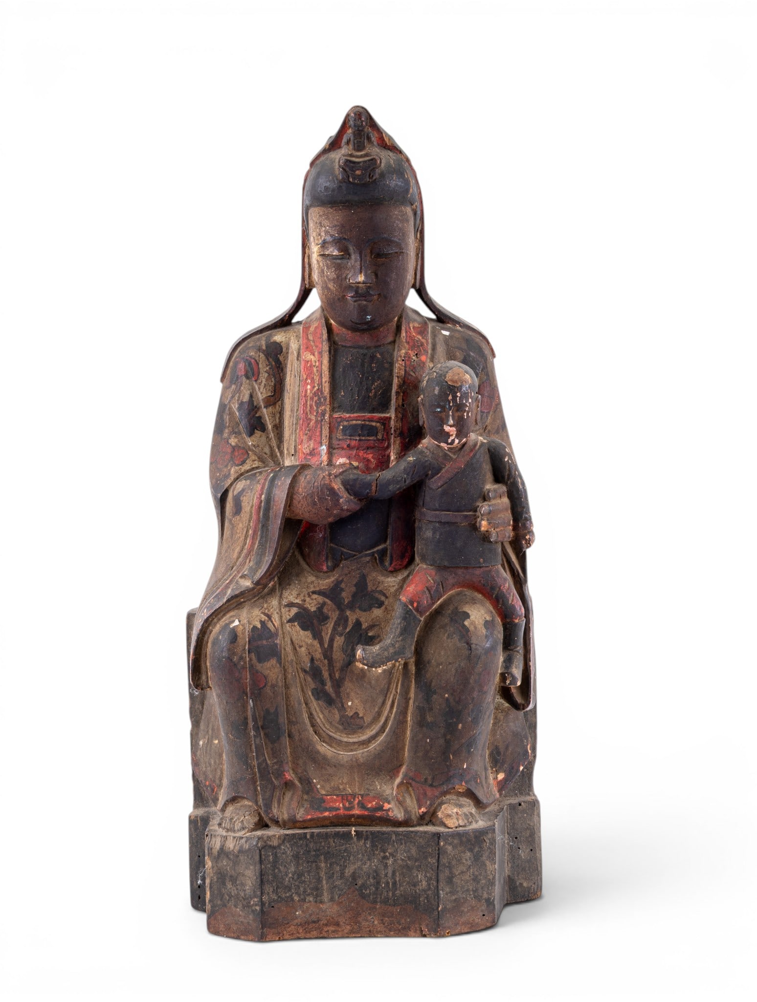 Chinese Carved Wooden Guan Yin Figure w/ Child: Chinese carved wooden temple figure depicting Guan Yin seated and holding a child. Figure retains original polychrome decoration in red, black, and gilt. Carved in the round with hollowed back. Some p