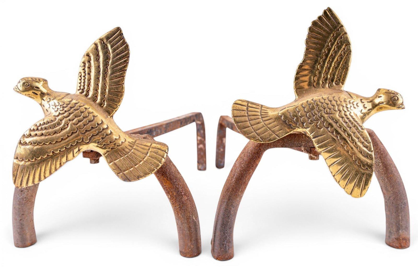 Brass Figural Bird Andirons: Pair of brass figural andirons, each in the form of a flying game bird with feather decoration. Mounted to wrought iron supports. Each measures approx. 18" L.