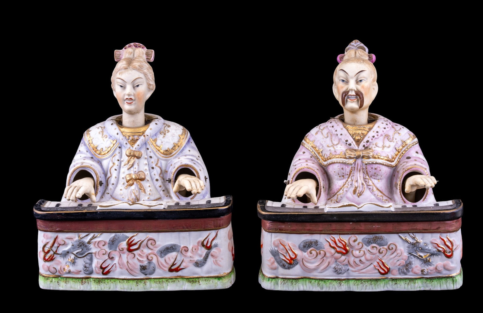 Lenwile China Ardalt Bisque Porcelain Nodders: A pair of Lenwile China Ardalt bisque porcelain nodding statuettes featuring nodding heads and hands depicted playing the piano. Both measure approx. 7.5" W x 5.5" D x 9" H. Marked on the inside 'Japa
